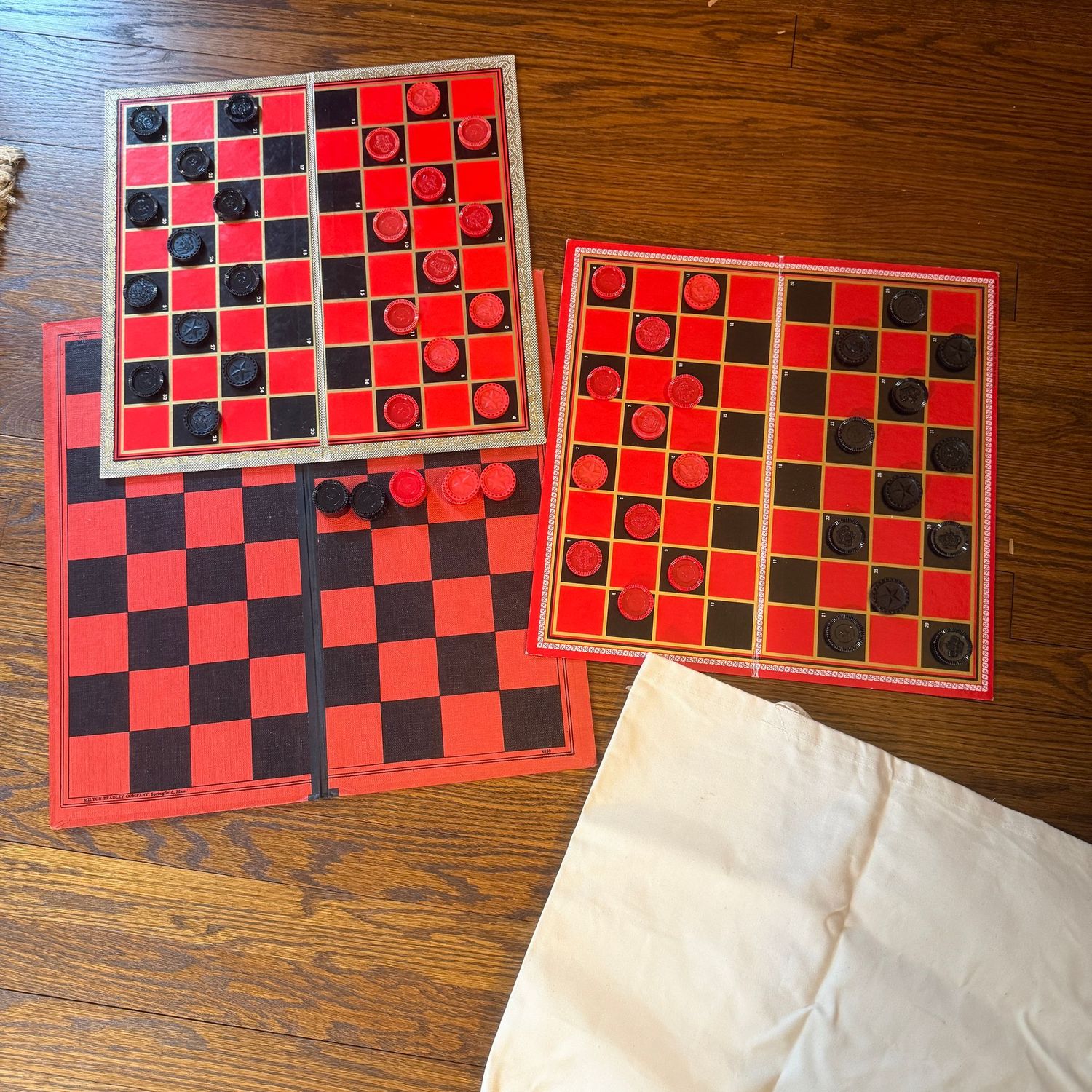 Three vintage checkerboards, two sets of checker pieces Three vintage checkerboards, two sets of checker pieces