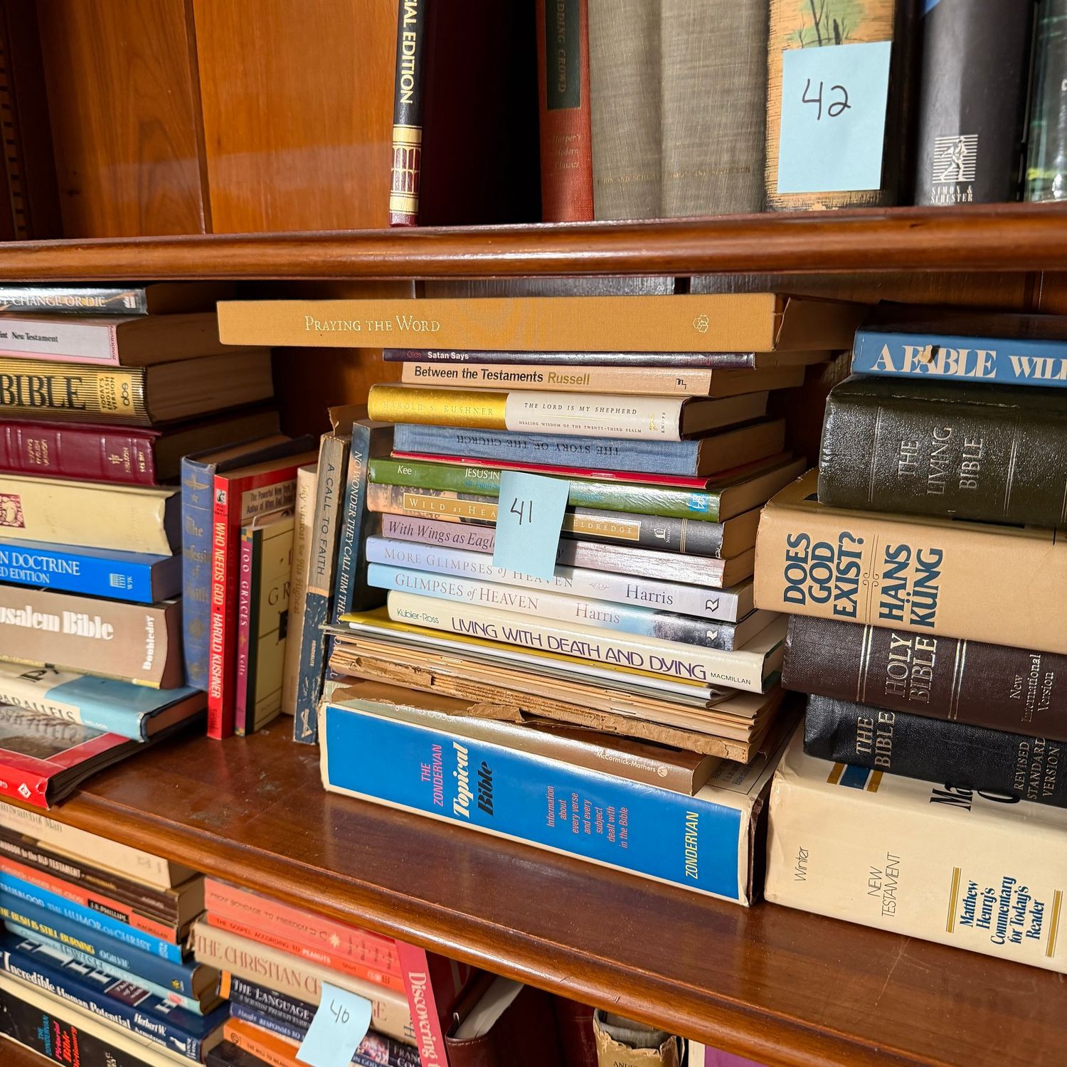 Book lot #41, shelf of spiritual books, including The Living Bible, Christian Doctrine