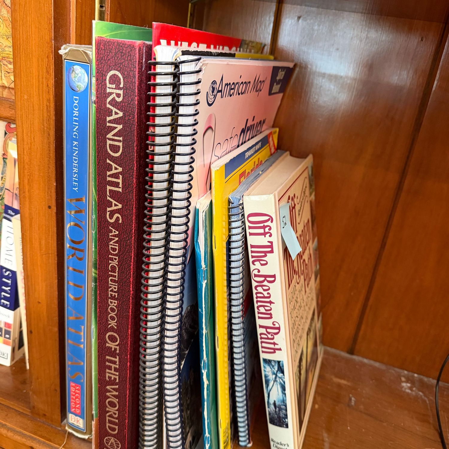 Book lot #52, including large books, World Atlas, spiral-bound maps