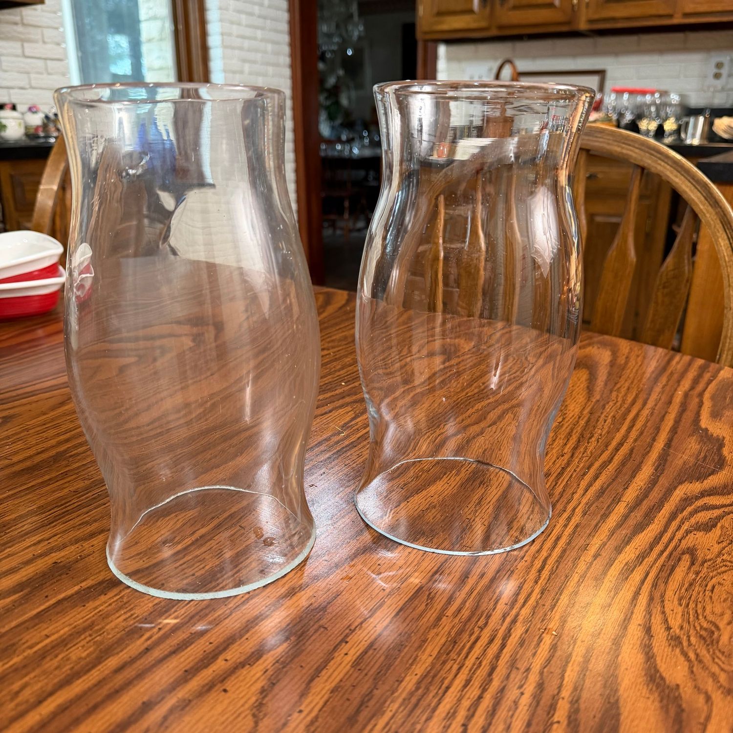 Two thick glass candle chimneys, base has some minor chips, will fit 3-3.5"W x 10"H