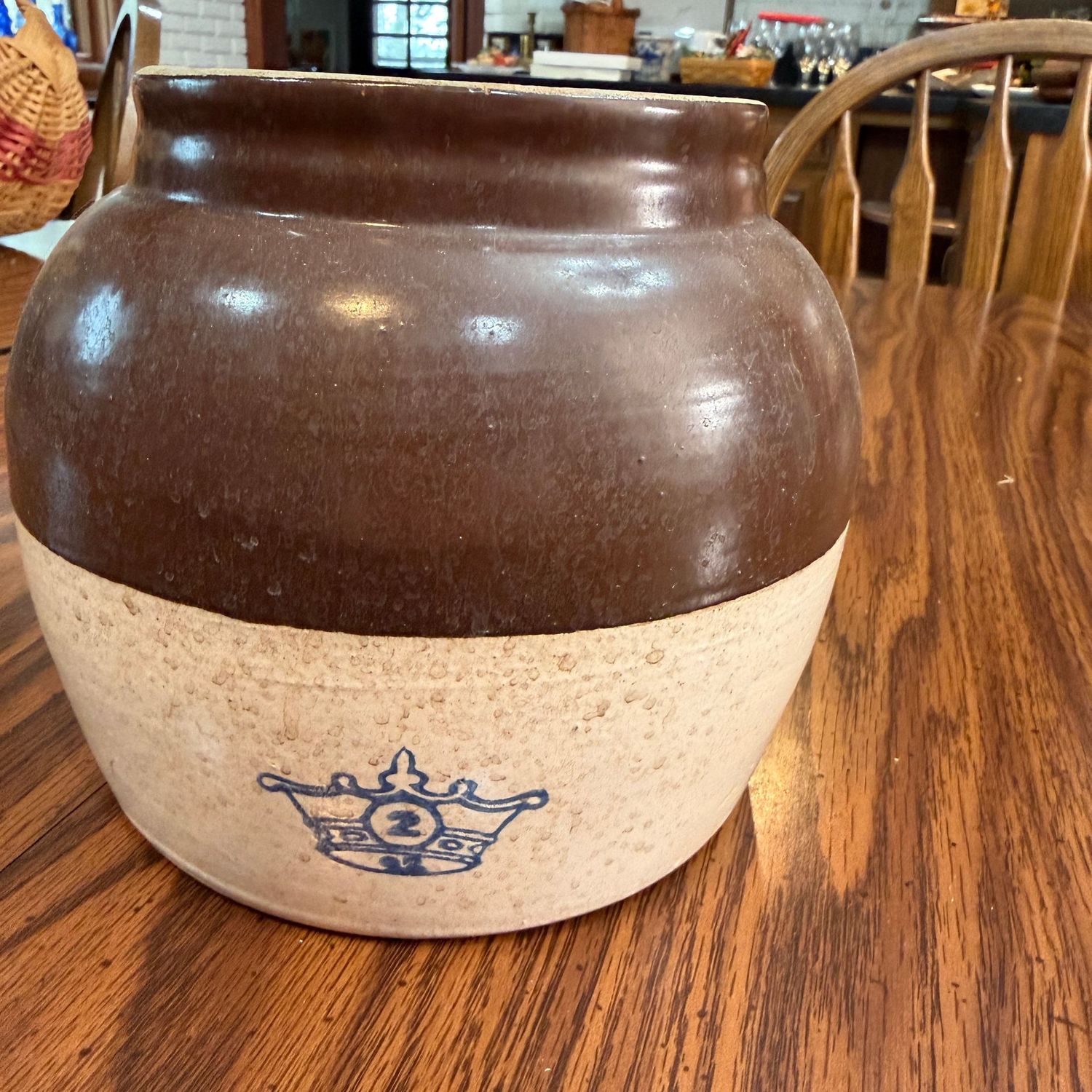 Number 2 bean pot with handle, some spots, minor chip to lip