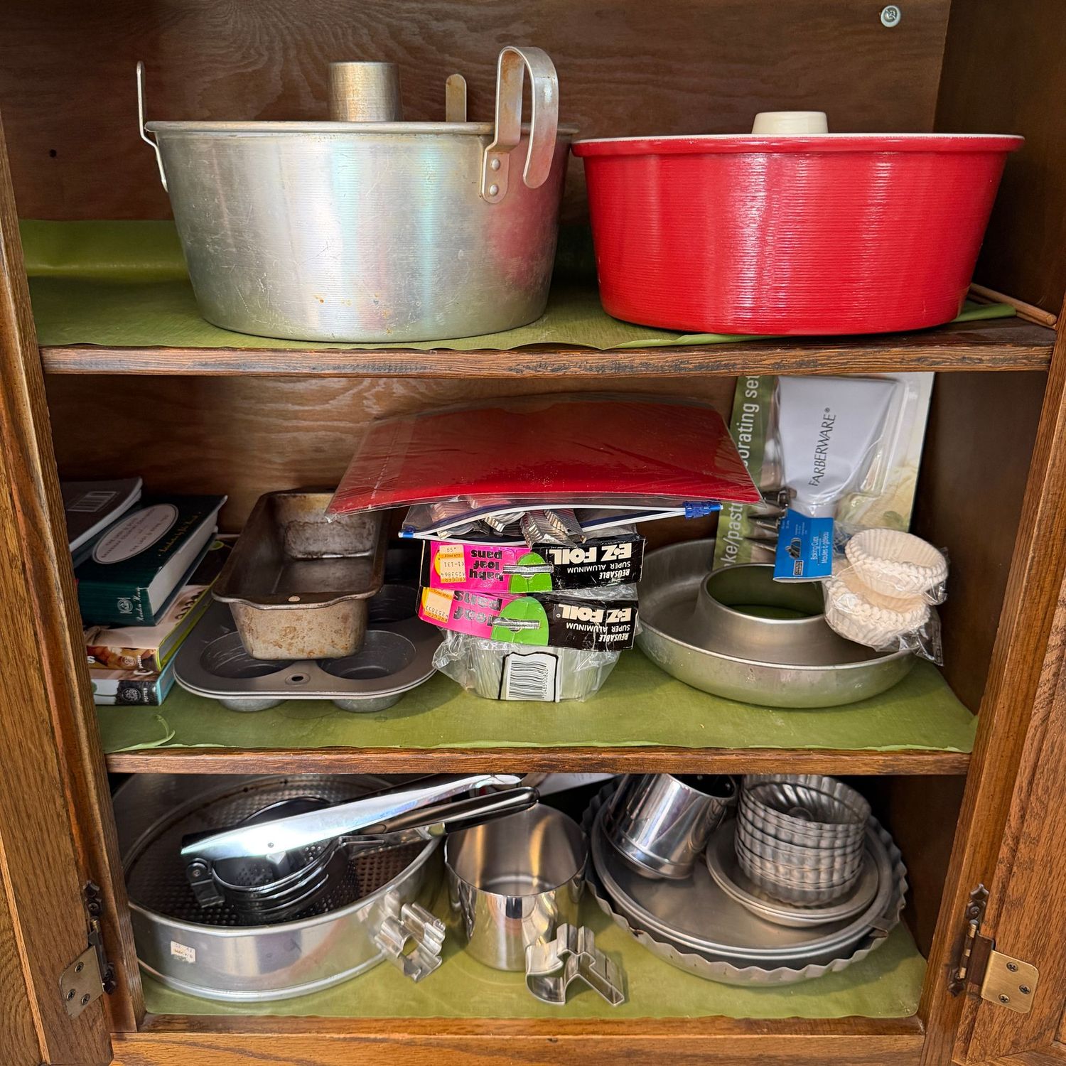 Cupboard E, baking supplies and pans, molds, presses