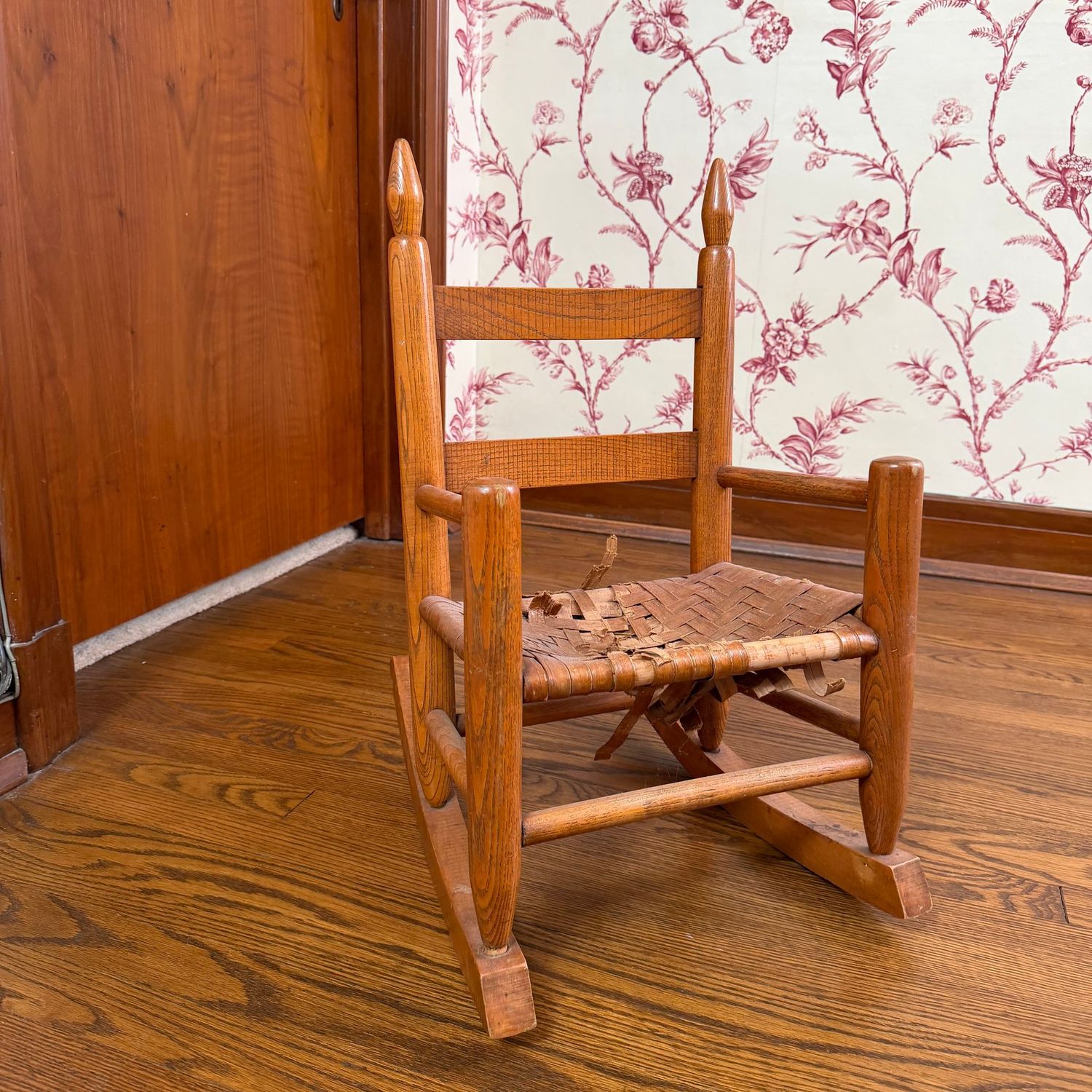 Vintage child's rocker, body in lovely condition, caned seat shows a lot of wear, great primitive decorative piece, 23"H x 15"W