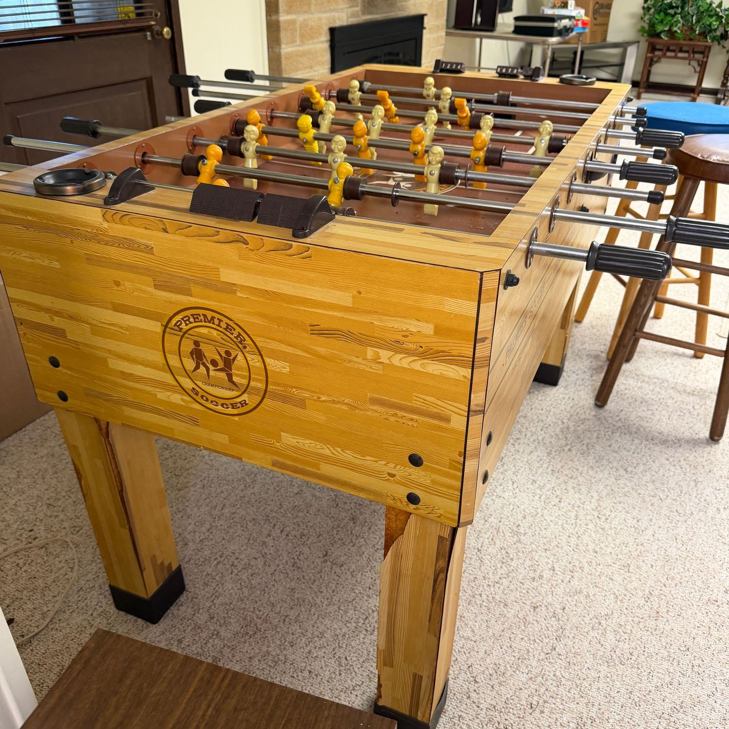 Vintage Premier Championship Soccer Foosball table, overall in good condition with some veneer loss on legs. (This item is in the lower level & may need legs removed for moving) 34"H x 32"W x 54"L