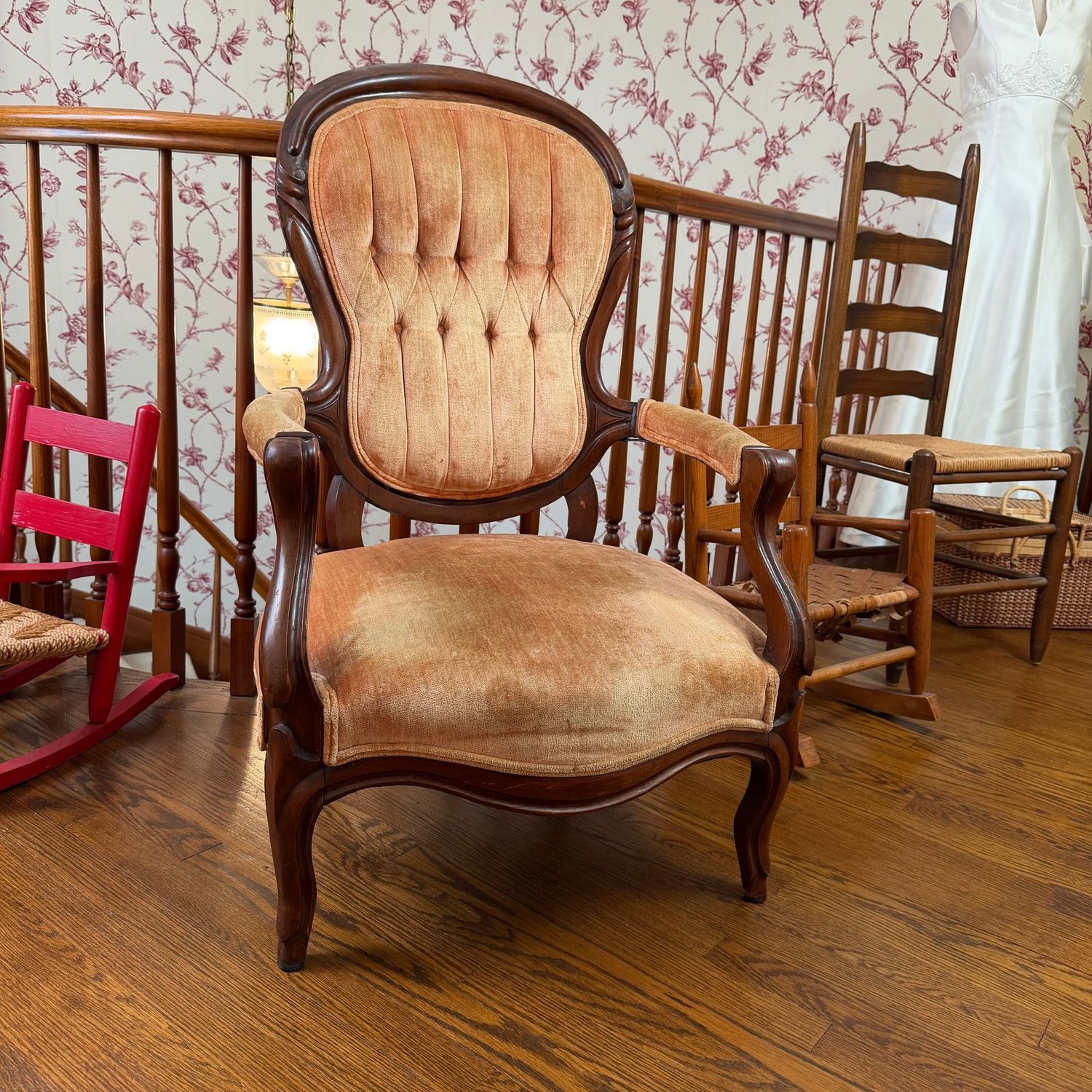 Victorian parlor chair, pale apricot upholstery, seat is low at 14"H x 24"W, and the back is 43"H (This item is heavy and upstairs)