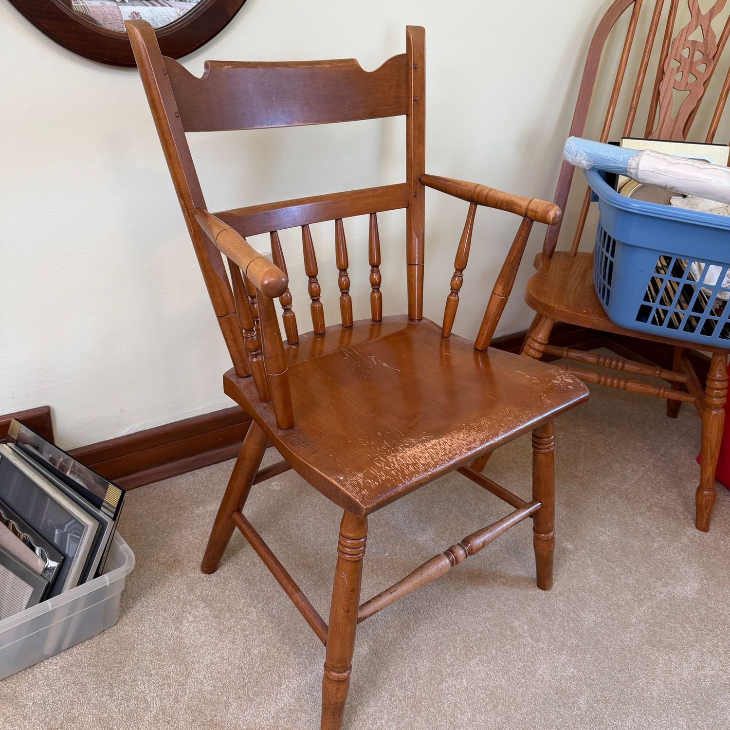 Conant Ball wooden armchair with partial spindle-back, some wear to finish, 44"H x 20"W (This item is upstairs)