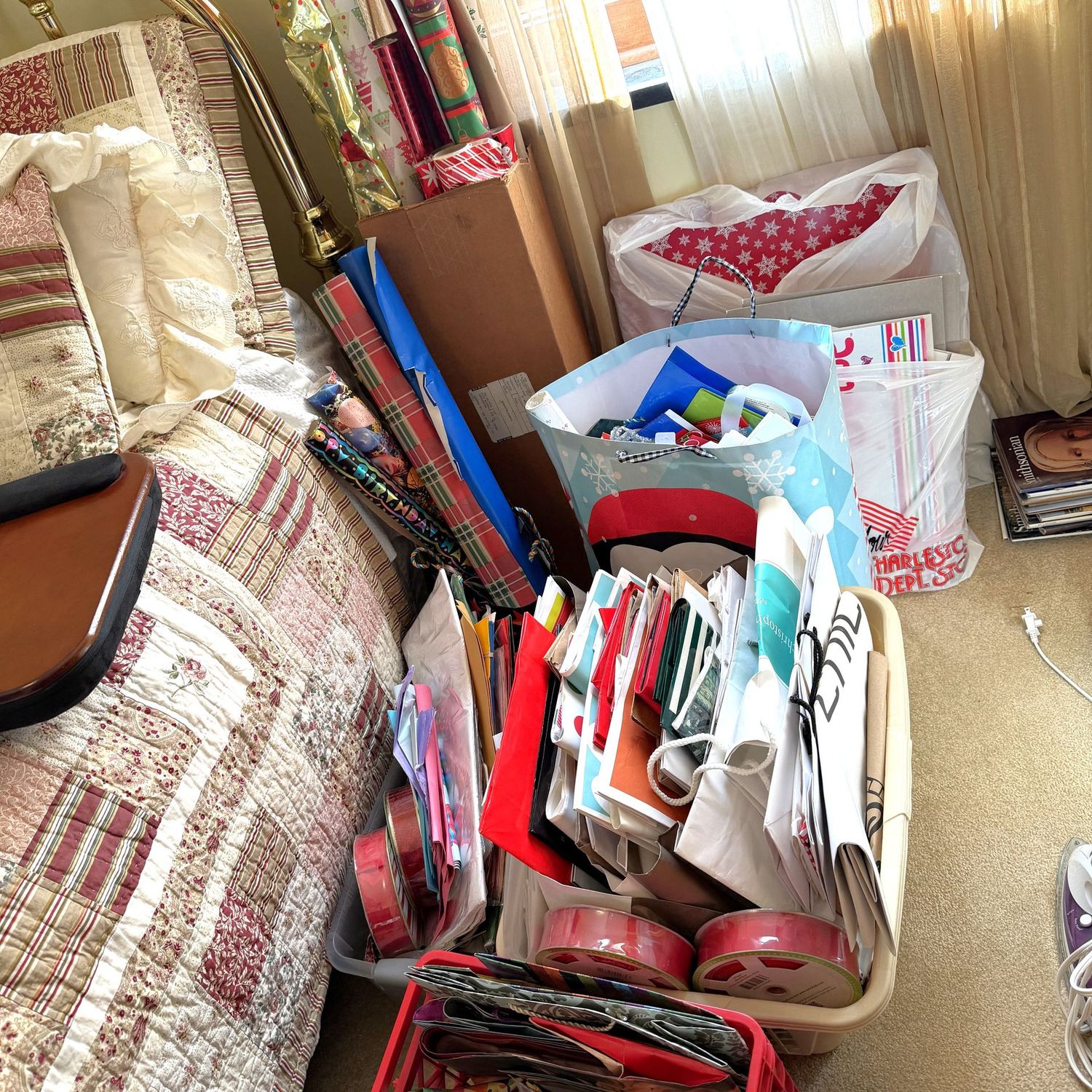 Large lot of partial wrapping paper rolls, store bags, gift bags, wrapping boxes, rolls of red ribbon