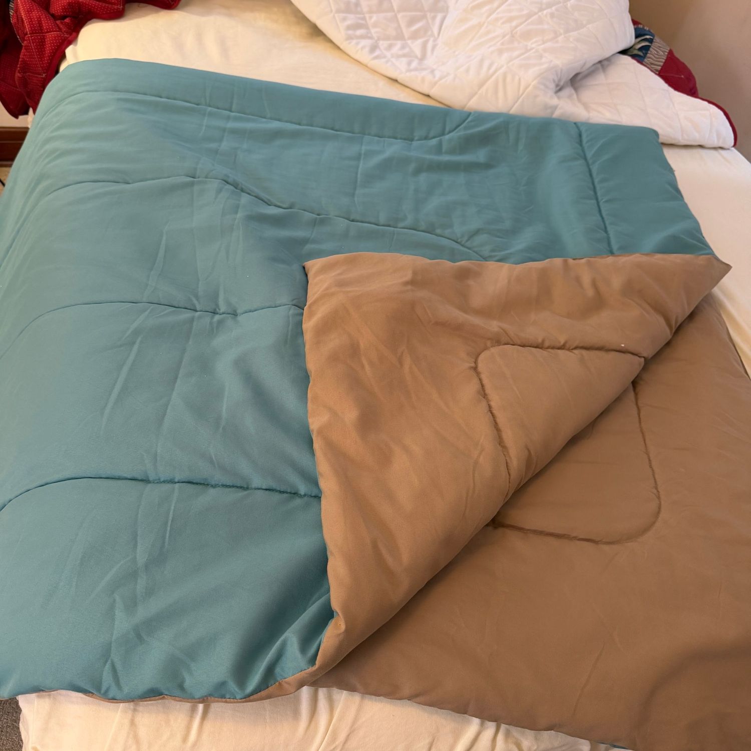 Full-size reversible teal and light brown quilt, needs minor cleaning