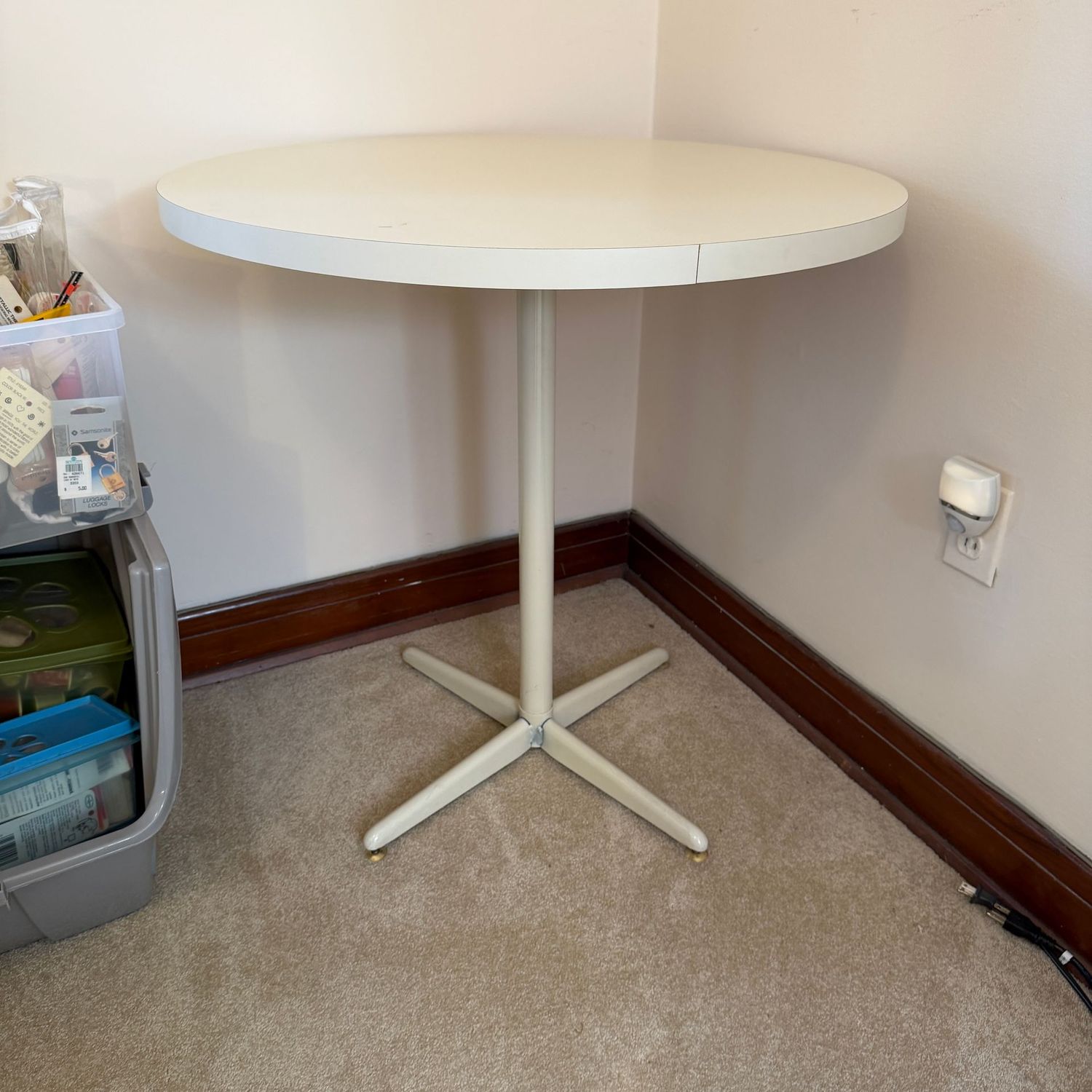 Round table with laminate top and metal legs, 30"H x 28"W (This item is heavy and upstairs)