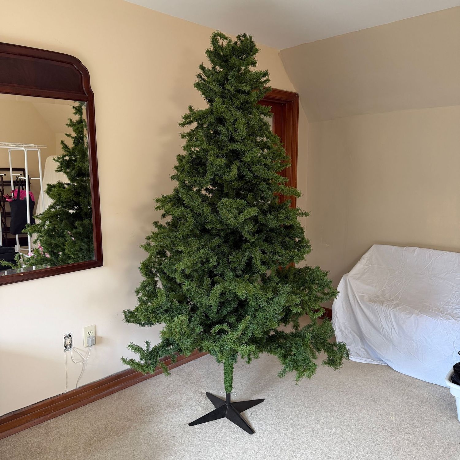 Tall artificial Christmas tree, 6'10" x 3'8", does shed a bit (but it has lots of needles to spare), very full branches, sturdy metal base (This item is heavy and is upstairs)