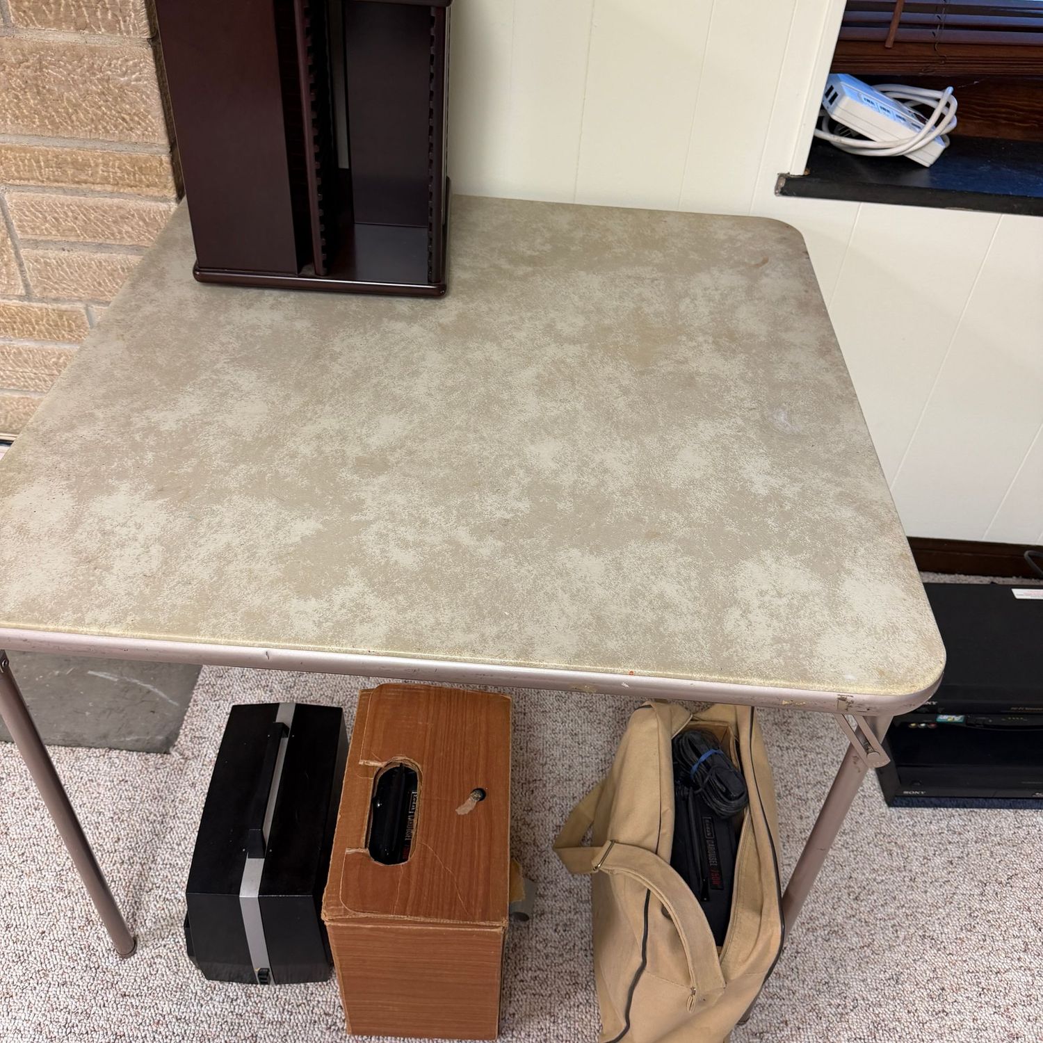 Marbled tan vinyl card table, minor wear, 34" (This item is heavy and in the lower level)