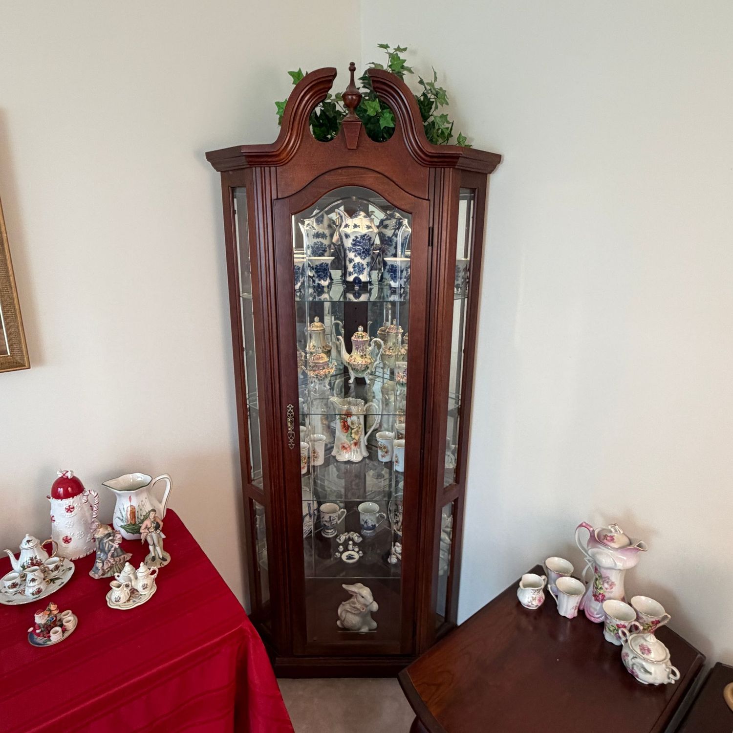 Tall lighted corner curio cabinet, adjustable glass shelves, side display windows, 6'5 Tall lighted corner curio cabinet, adjustable glass shelves, side display windows, 6'5"H x 34"W x approx. 19"D