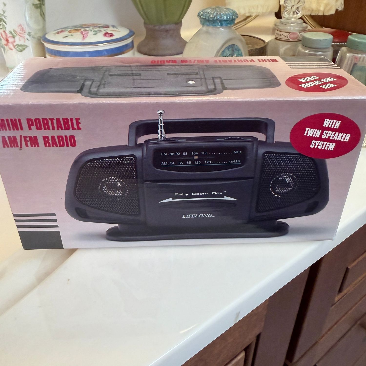 Mini portable AM/FM radio, in box