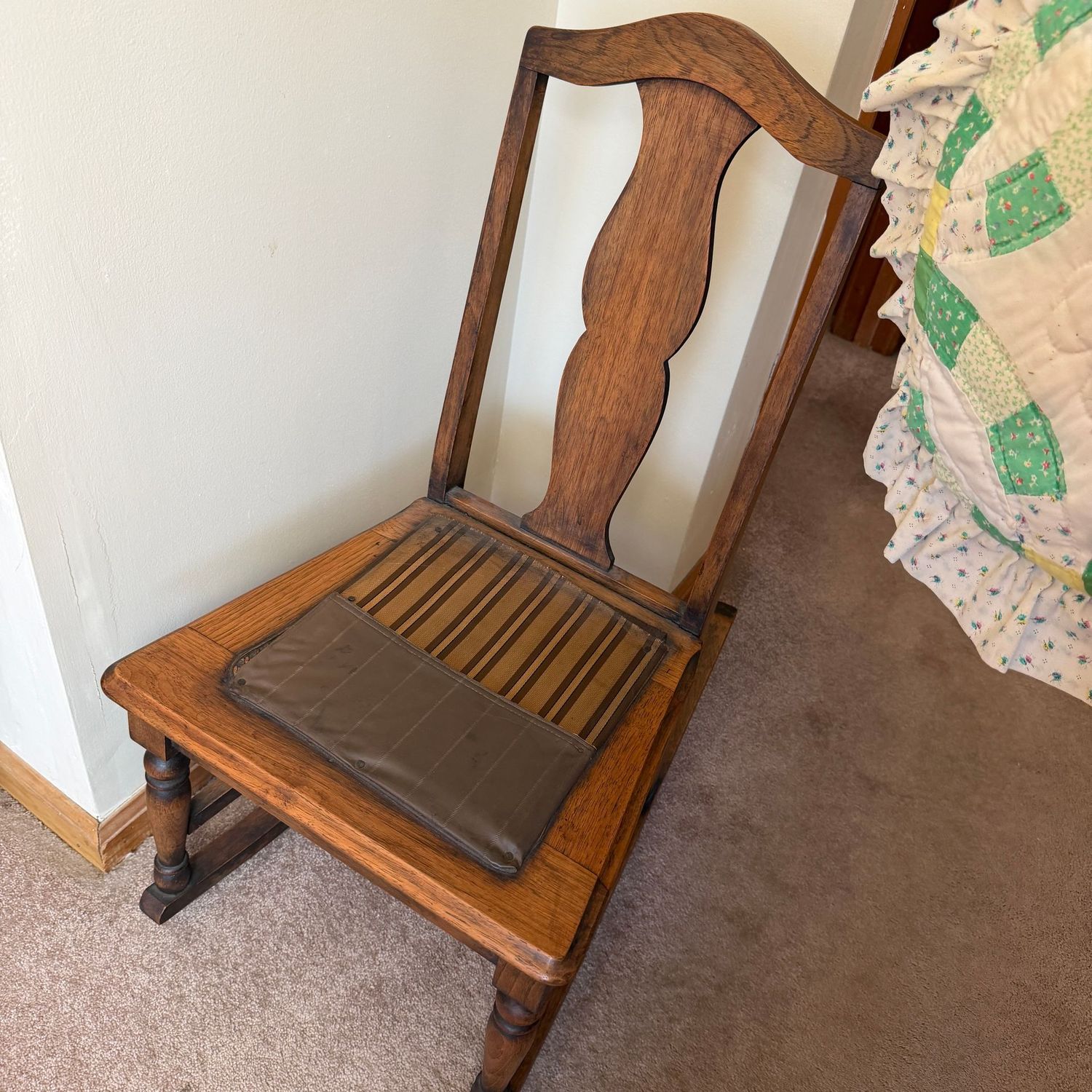 Sewing rocker with arched top and brown striped fabric seat cover, seat center has been replaced, 34"H x 17"W