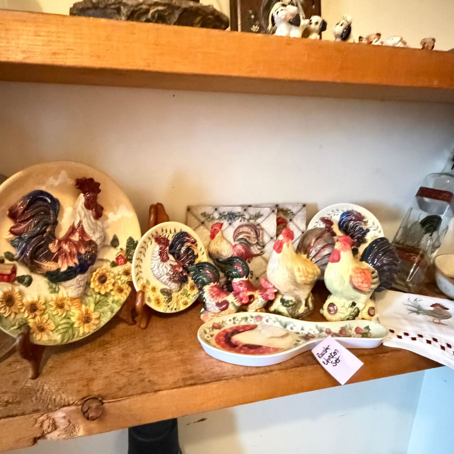 Group of mostly ceramic roosters and chickens, decorative plates, plaques, salt & pepper, spoon rests, oil bottle