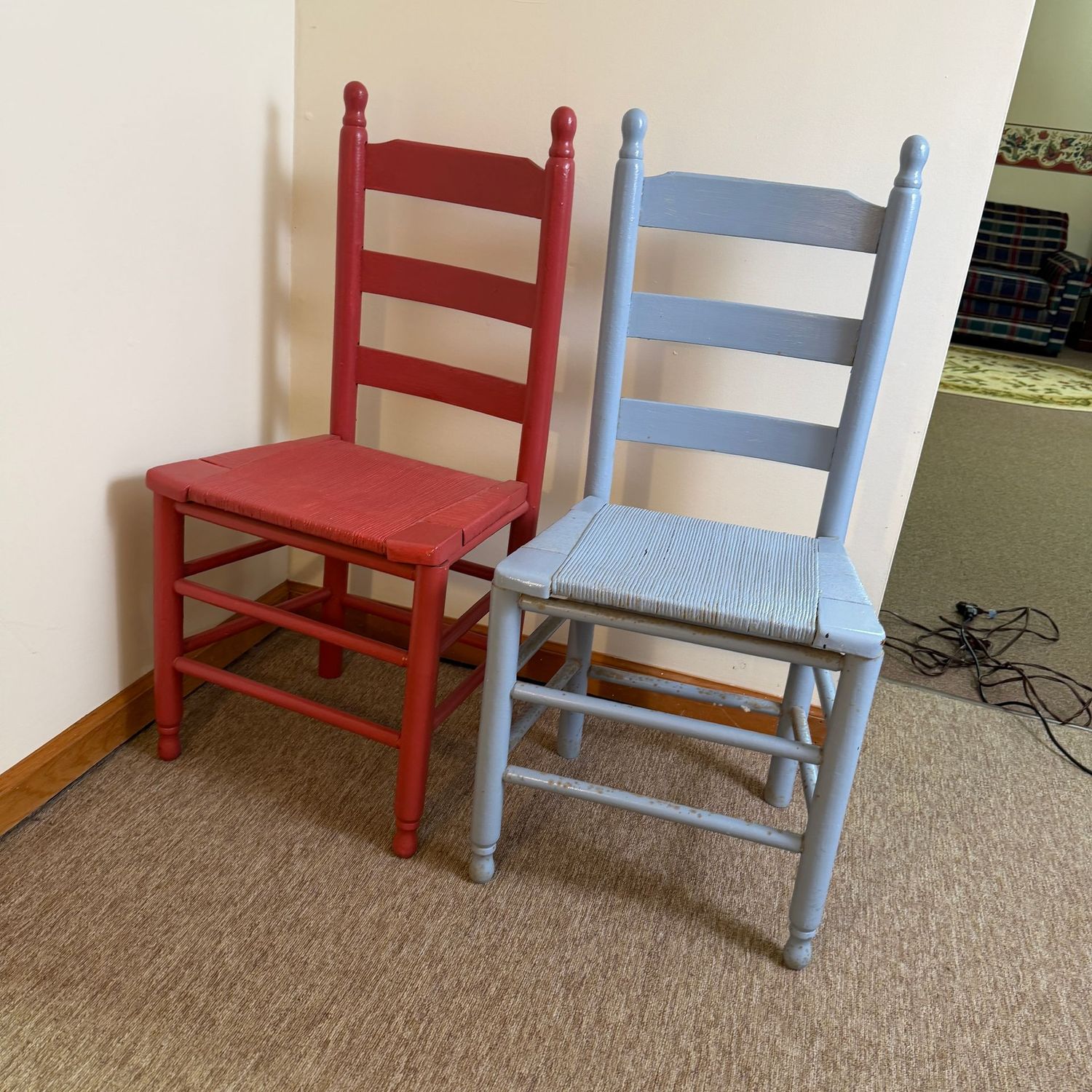 Colorful pair of ladder-back chairs with rope seats, painted sky blue and berry red, 38"H x 17"W