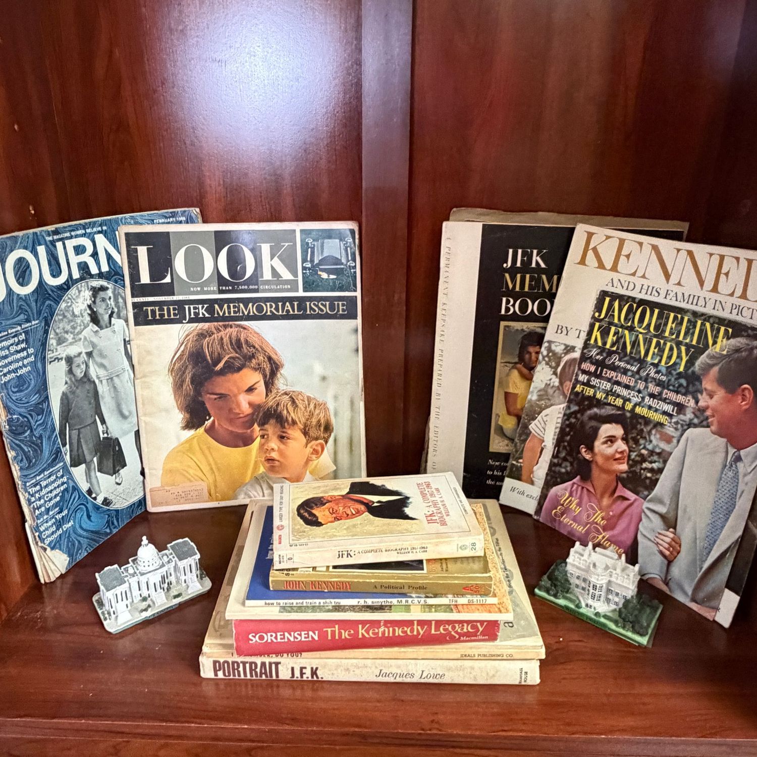 Display of Kennedy magazines, books, resin White House and Capitol Display of Kennedy magazines, books, resin White House and Capitol