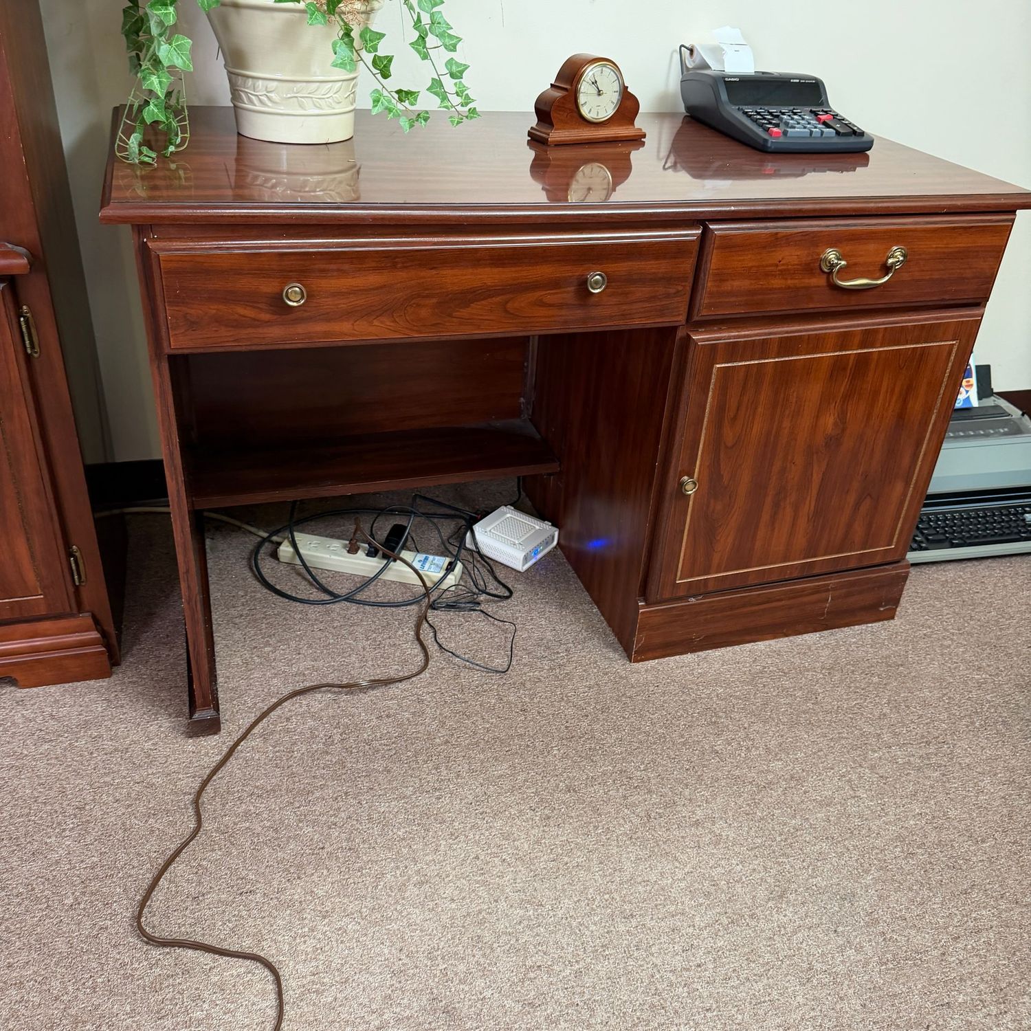 Small laminate work desk, pull-out shelf on right, some wear, 30"H x 23"D x 48"W (This item is heavy and in the lower level - OK to use a dolly)
