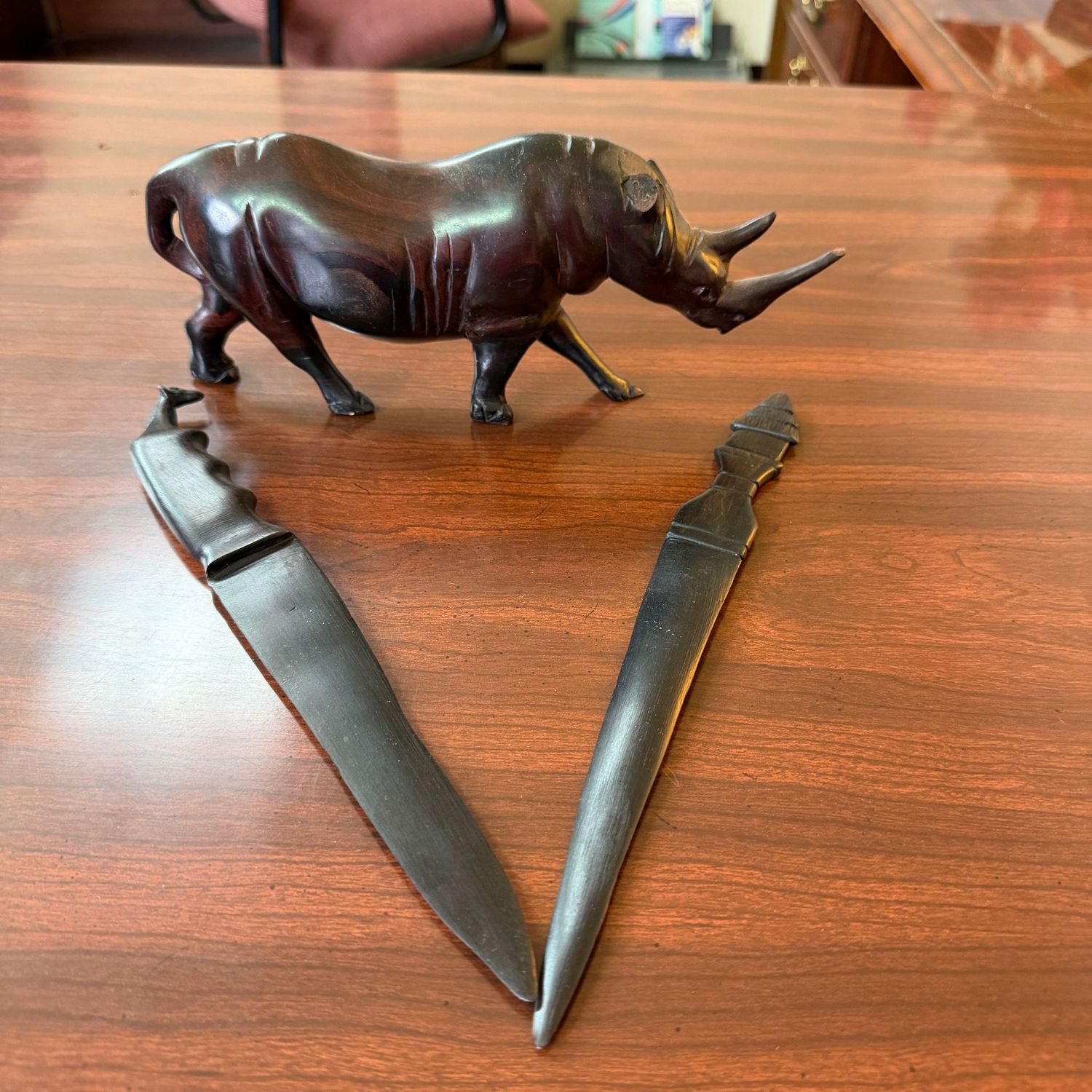 Carved wood letter openers and rhino (has broken ears), 9"L