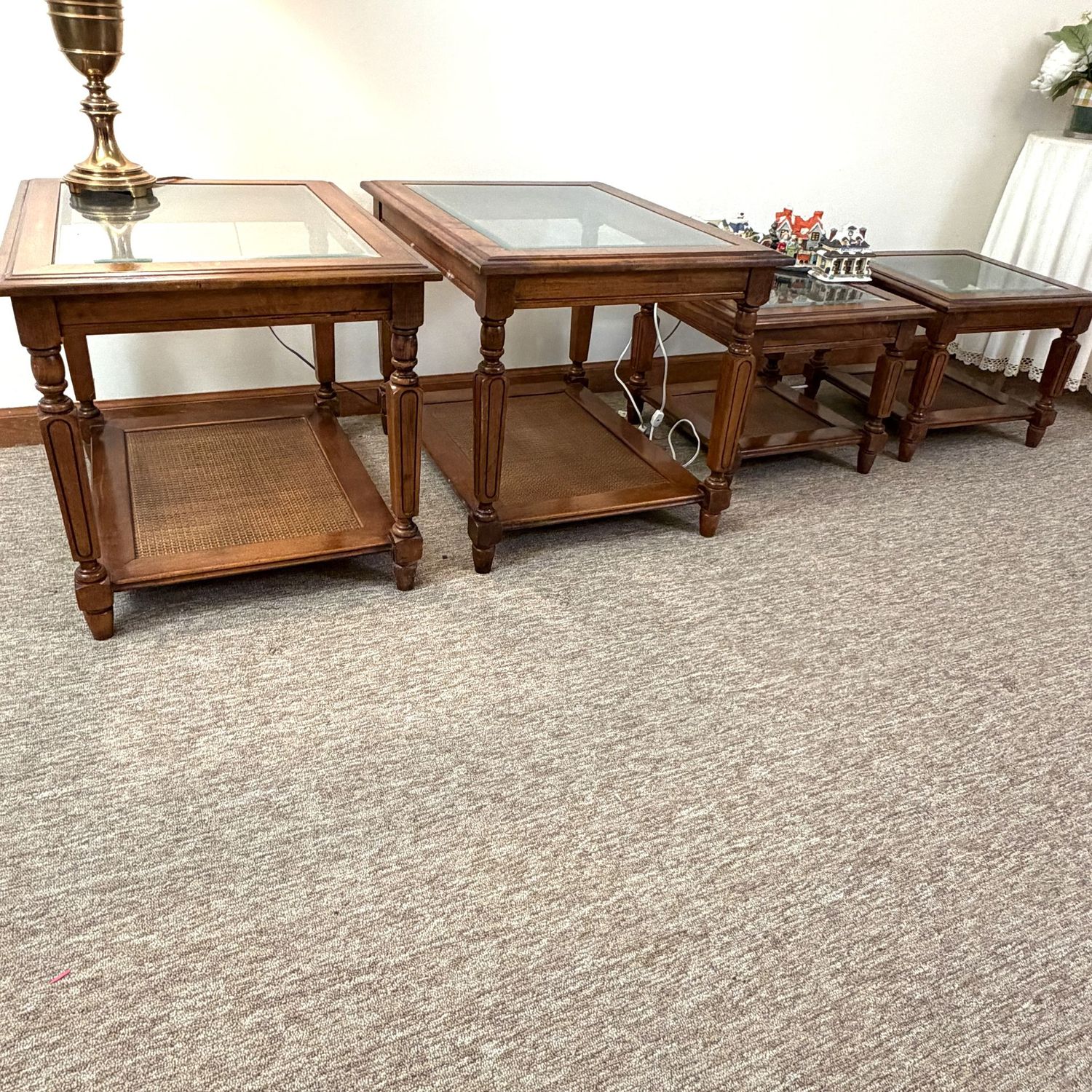 Set of 4 vintage end (20"H x 27"L x 20"W), and coffee tables (18"x18"x14"), cane shelves, beveled glass tops,  (This item is heavy and in the lower level)