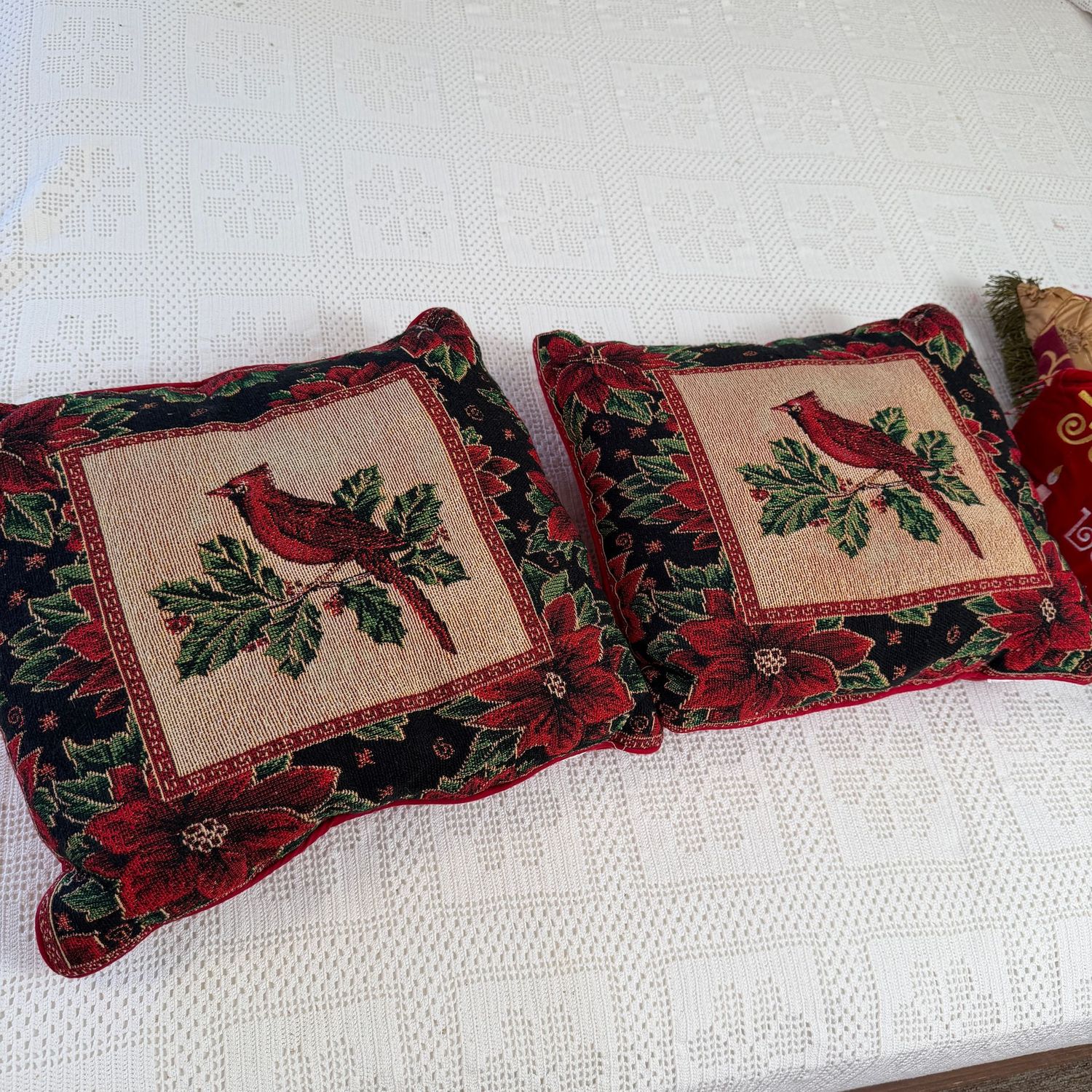 Two cardinal accent pillows, 14"W