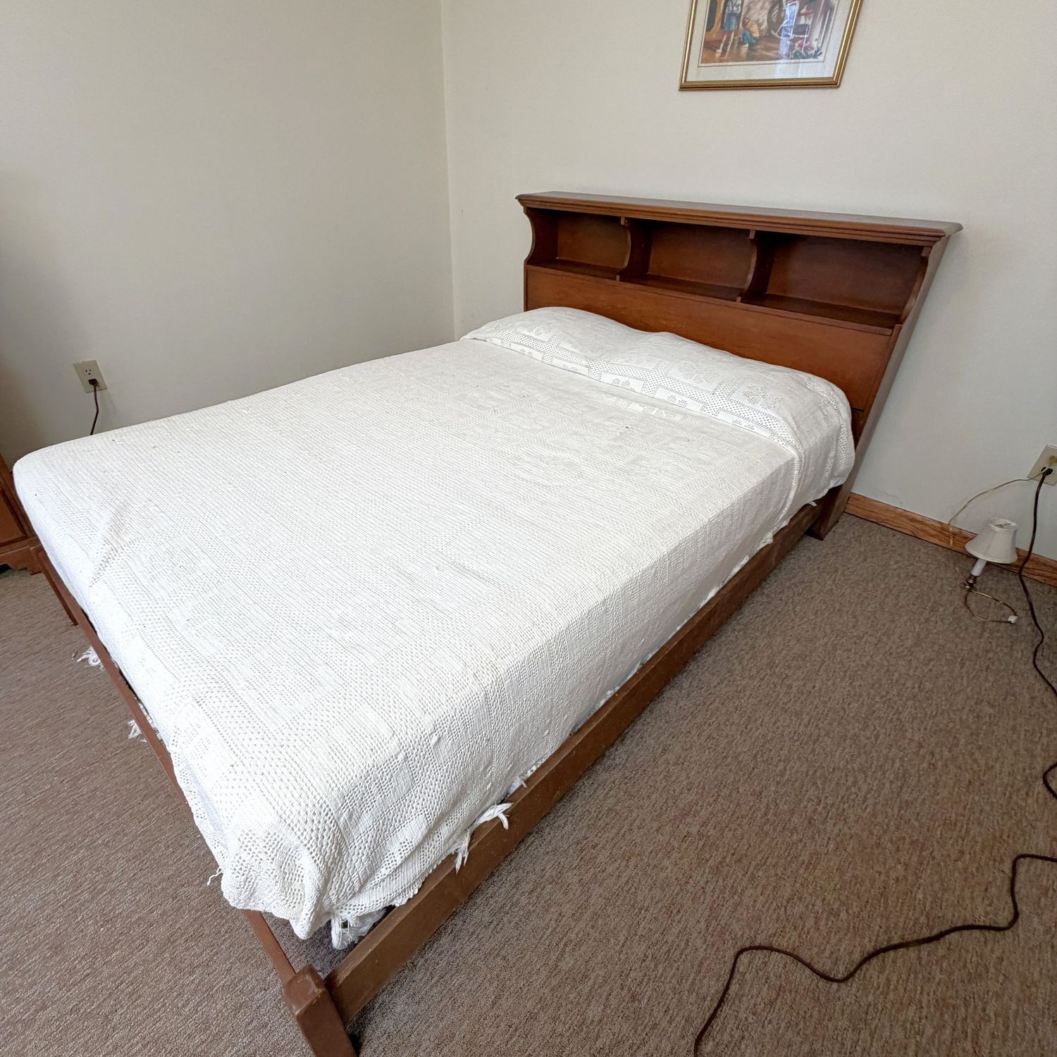 Vintage full-size bed frame with storage headboard (36 Vintage full-size bed frame with storage headboard (36"H), overall good condition, feet show water damage (This item is heavy and in the lower level - OK to use a dolly)