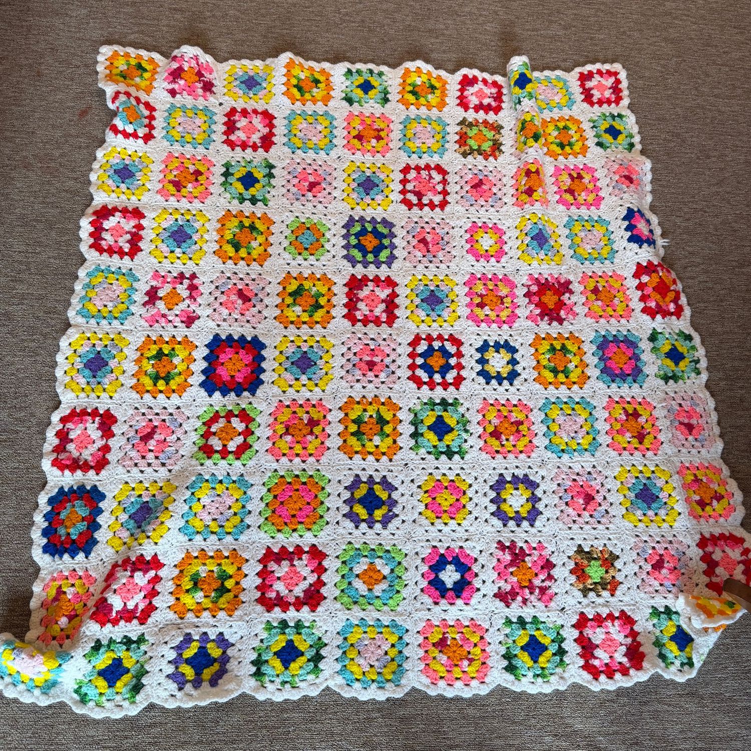 Bright colored granny square crocheted blanket, a little wear, 46" x 52"