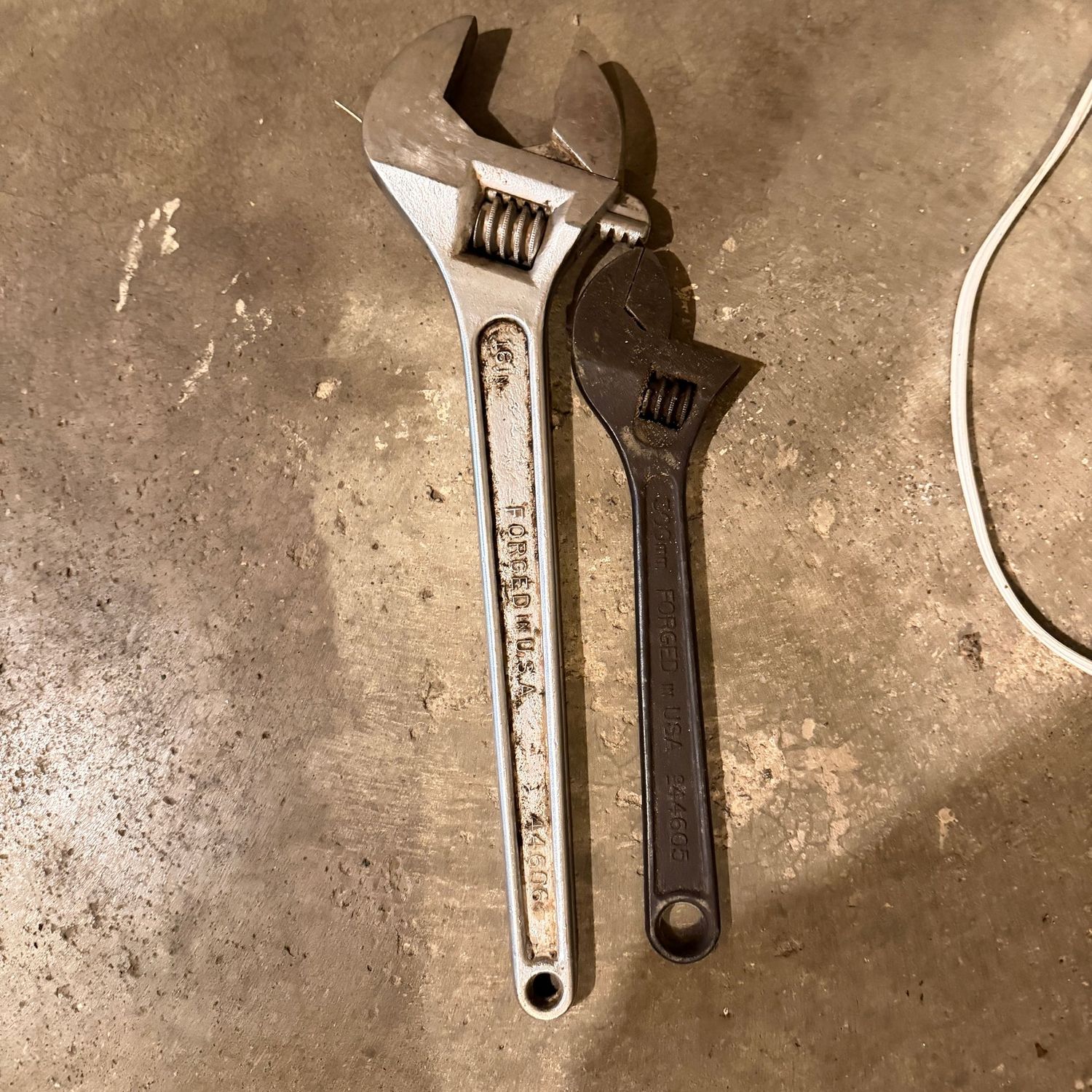 Two forged adjustable wrenches, 12" x 15"