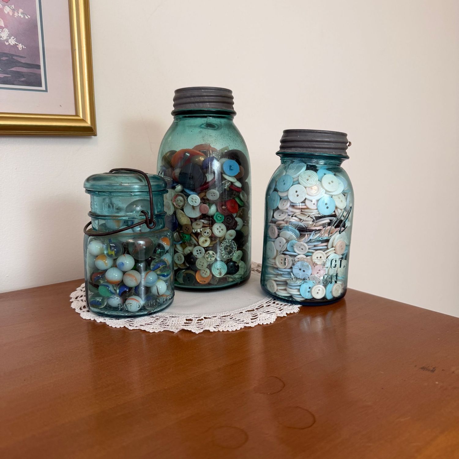 Blue canning jars filled with buttons and marbles Blue canning jars filled with buttons and marbles