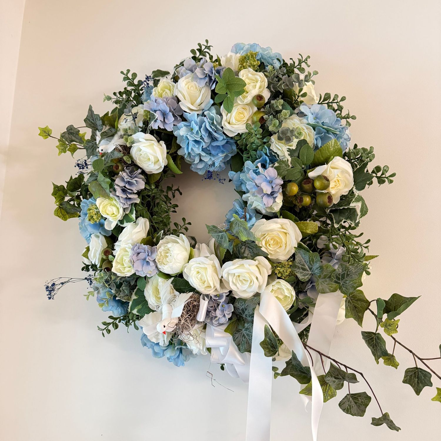 Large wreath with blue and white flowers, 25"W