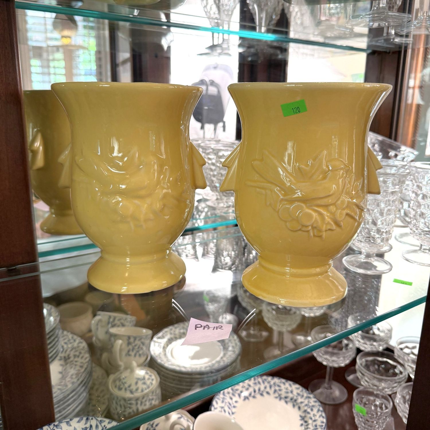 Lot #120, pair of yellow McCoy pottery bird vases, one has a minor chip, 8.5"