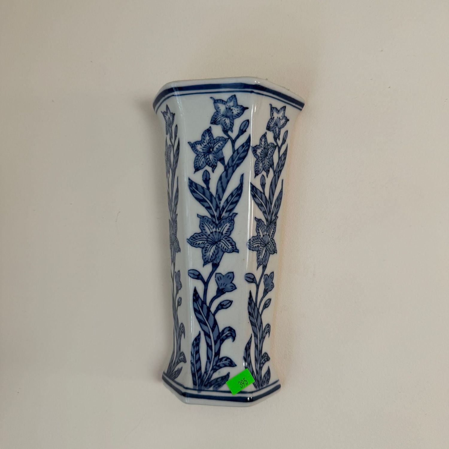 Lot #395, blue and white Seymour Mann paneled ceramic wall pocket vase, 10"