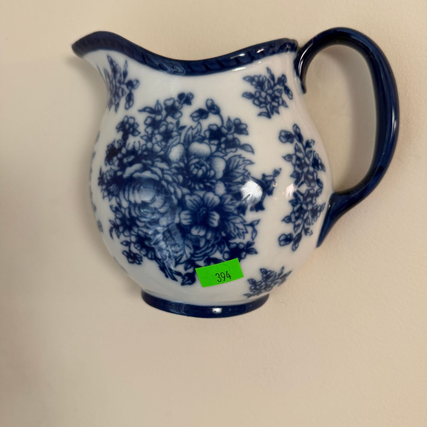 Lot #394, blue and white floral wall pocket pitcher, 6"