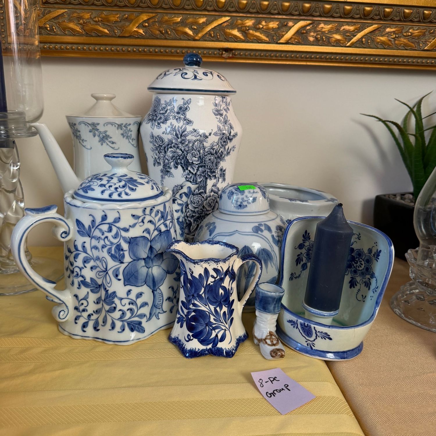 Lot #150, blue and white ceramic 8-piece group with teapots, pitcher, ginger jar, candle holder, shoe, & 12 Lot #150, blue and white ceramic 8-piece group with teapots, pitcher, ginger jar, candle holder, shoe, & 12" vase