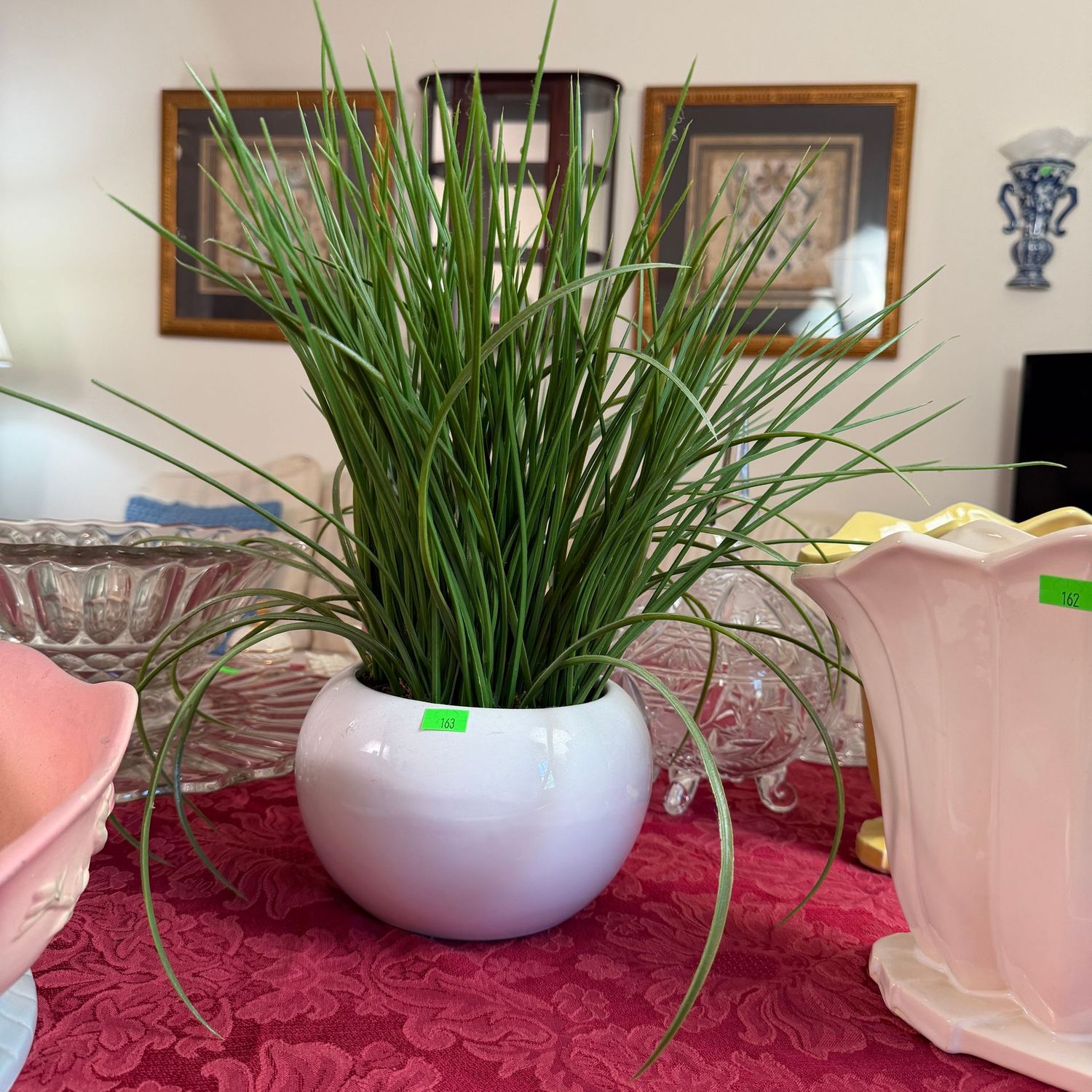 Lot #163, faux grassy arrangement in round white planter, 14"