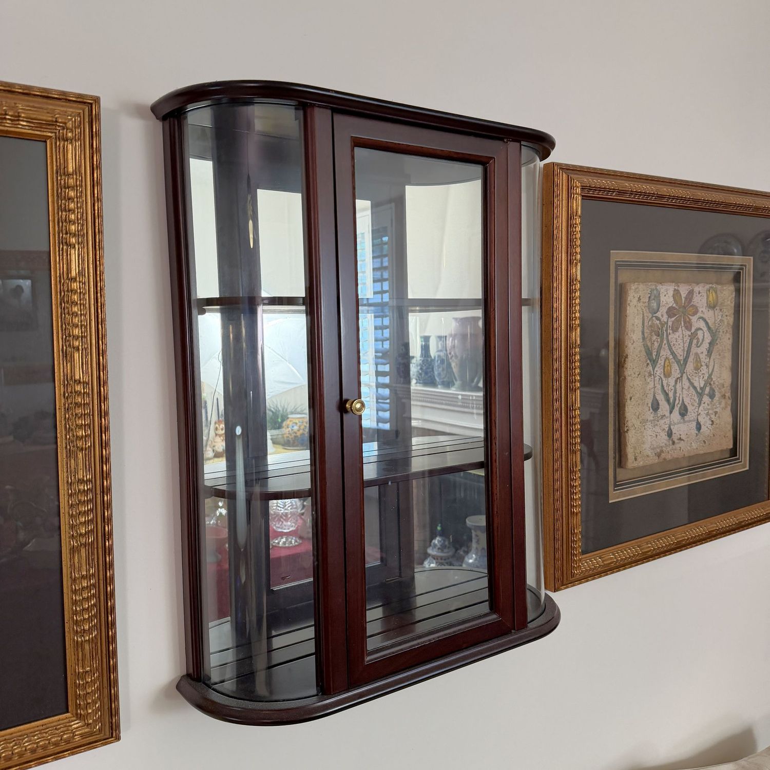 Dark cherry curio cabinet, likely Bombay, mirrored back, plate grooves, 26"H x 20"W