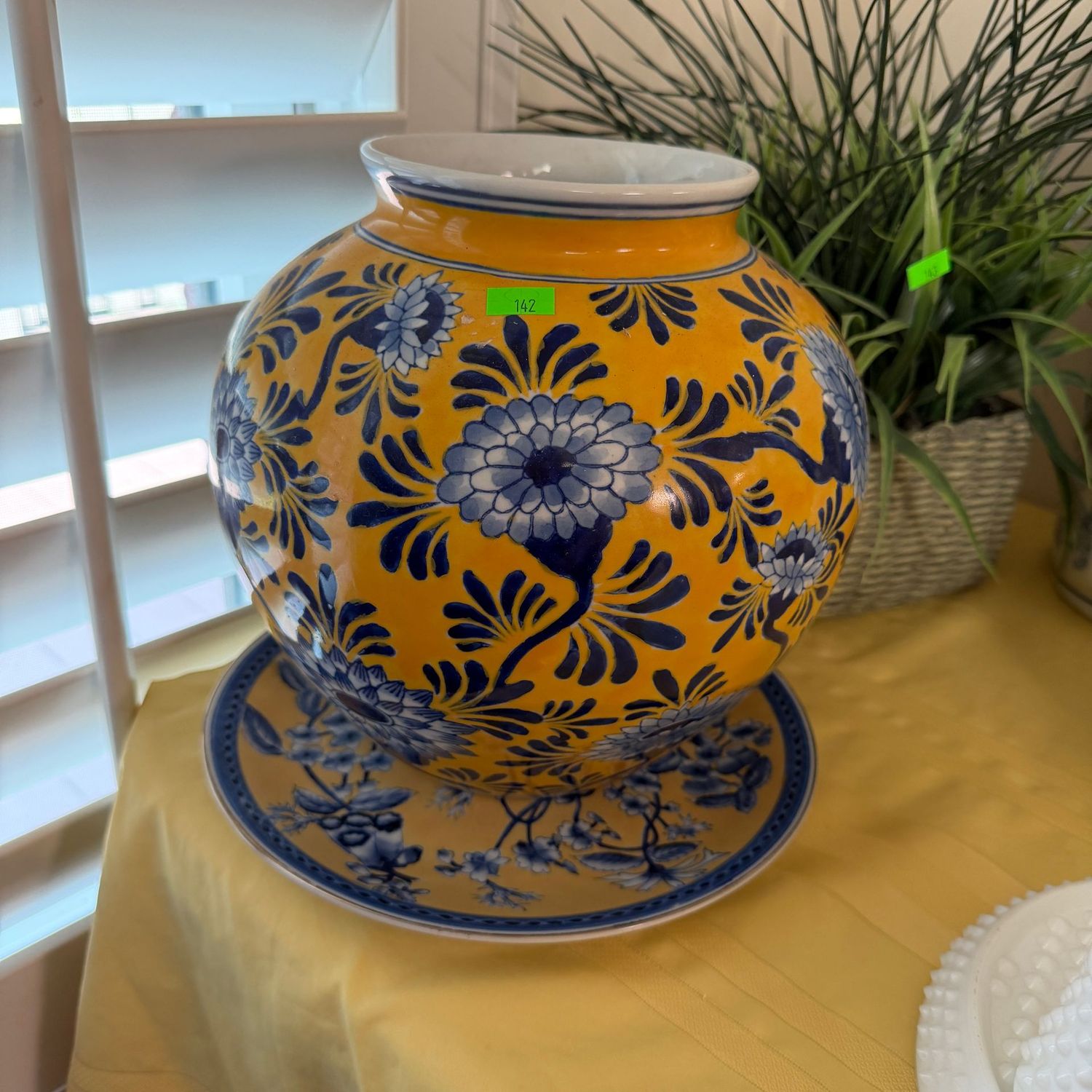 Lot #142, yellow and blue floral round Seymour Mann vase with coordinating plate, 9.5"H