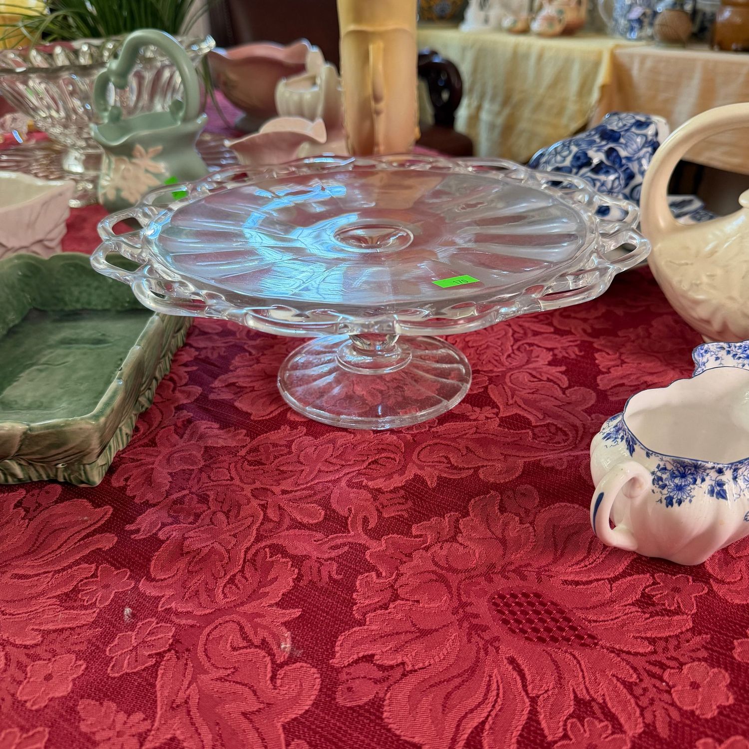 Lot #170, Imperial clear glass cake stand, open lace border, 12"W