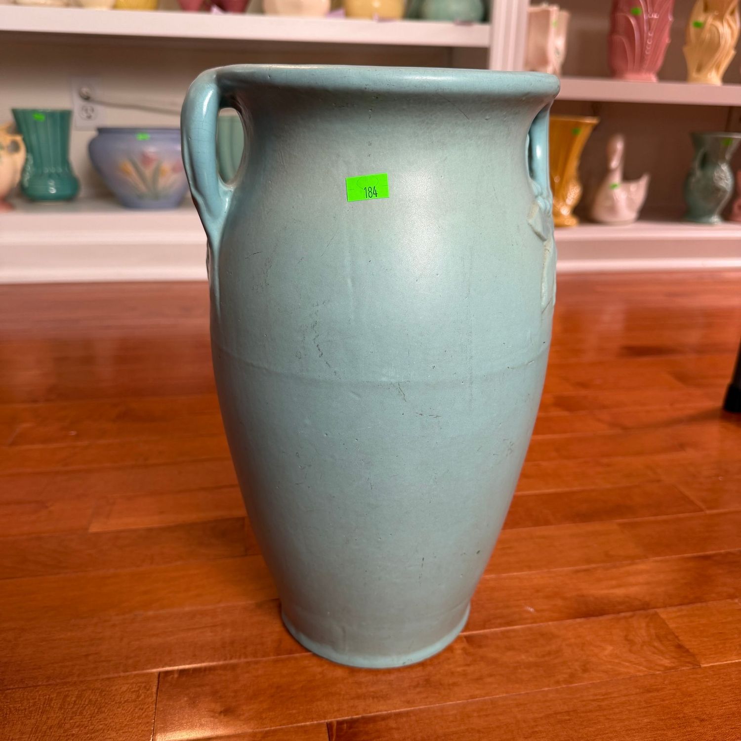 Lot #184, large aqua blue U.S.A. pottery vase with leaf handles, minor chip on base, 14"