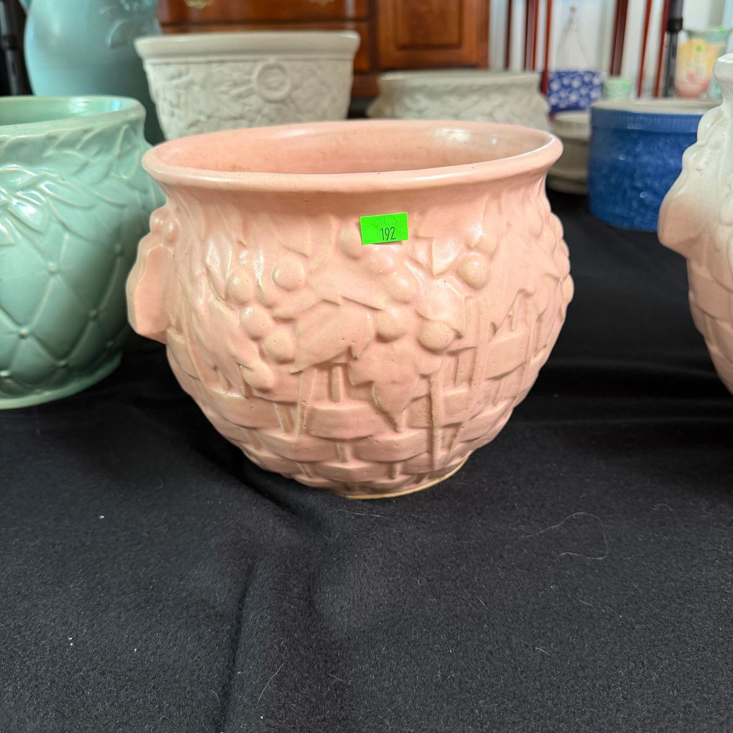 Lot #192, McCoy pottery pink basketweave and berry jardiniere, 6.25"H x 7"W