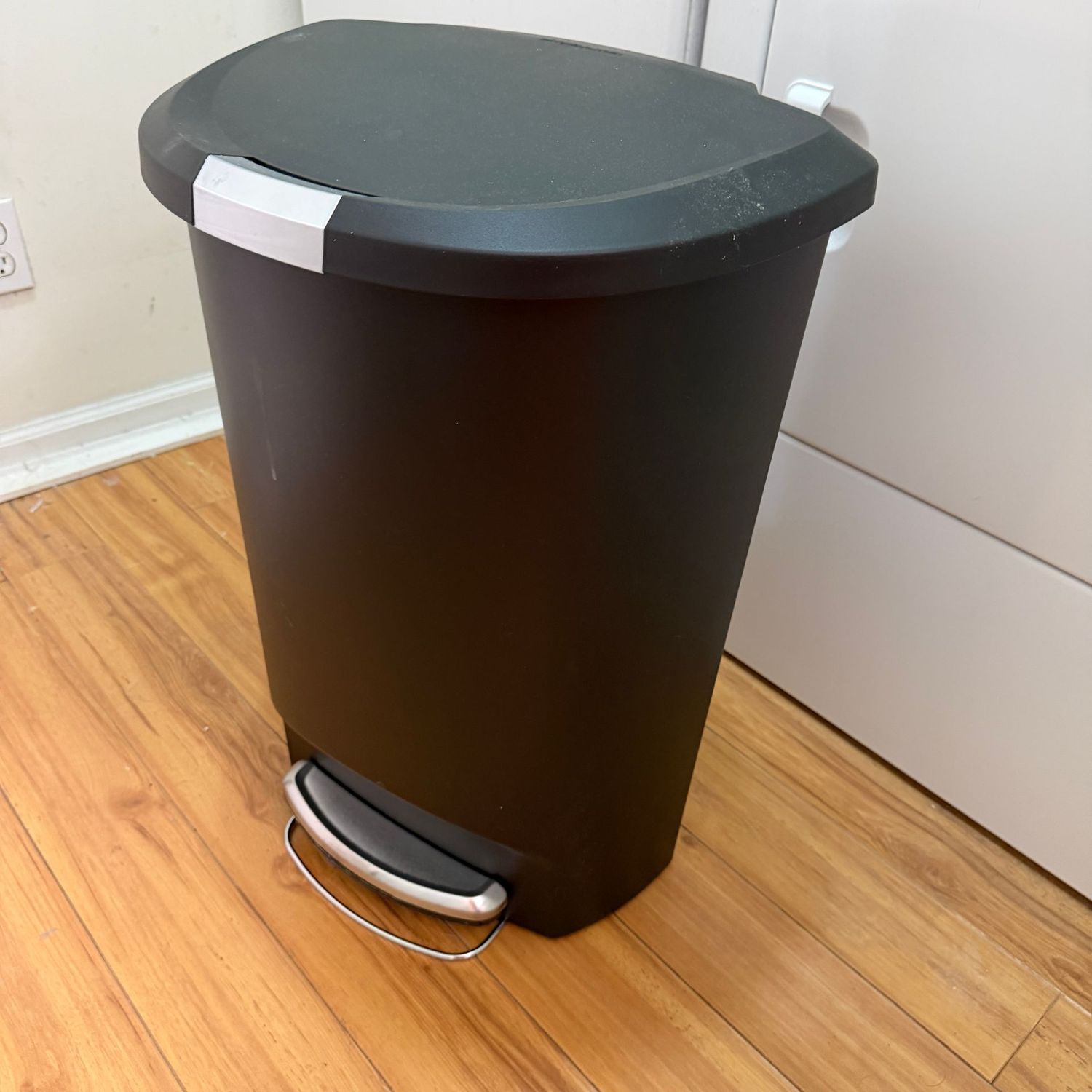 Black plastic Simple Human kitchen trash can with foot pedal opener, works well, 26"H
