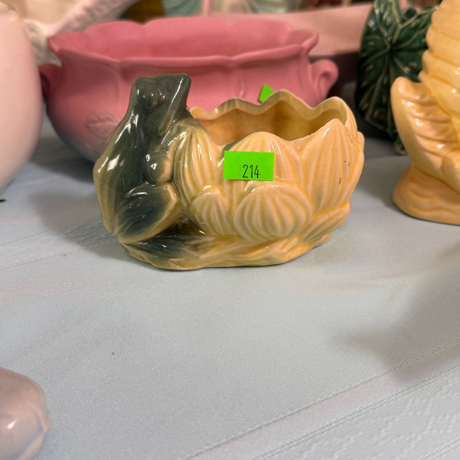 Lot #214, McCoy pottery green and yellow frog planter, 5"L