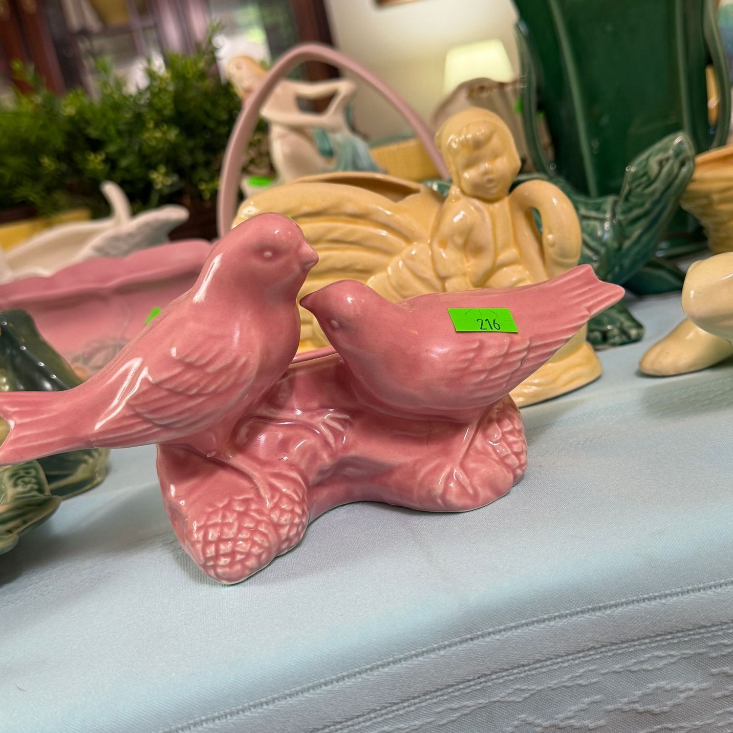 Lot #216, pink McCoy pottery songbird planter, 7.5"L