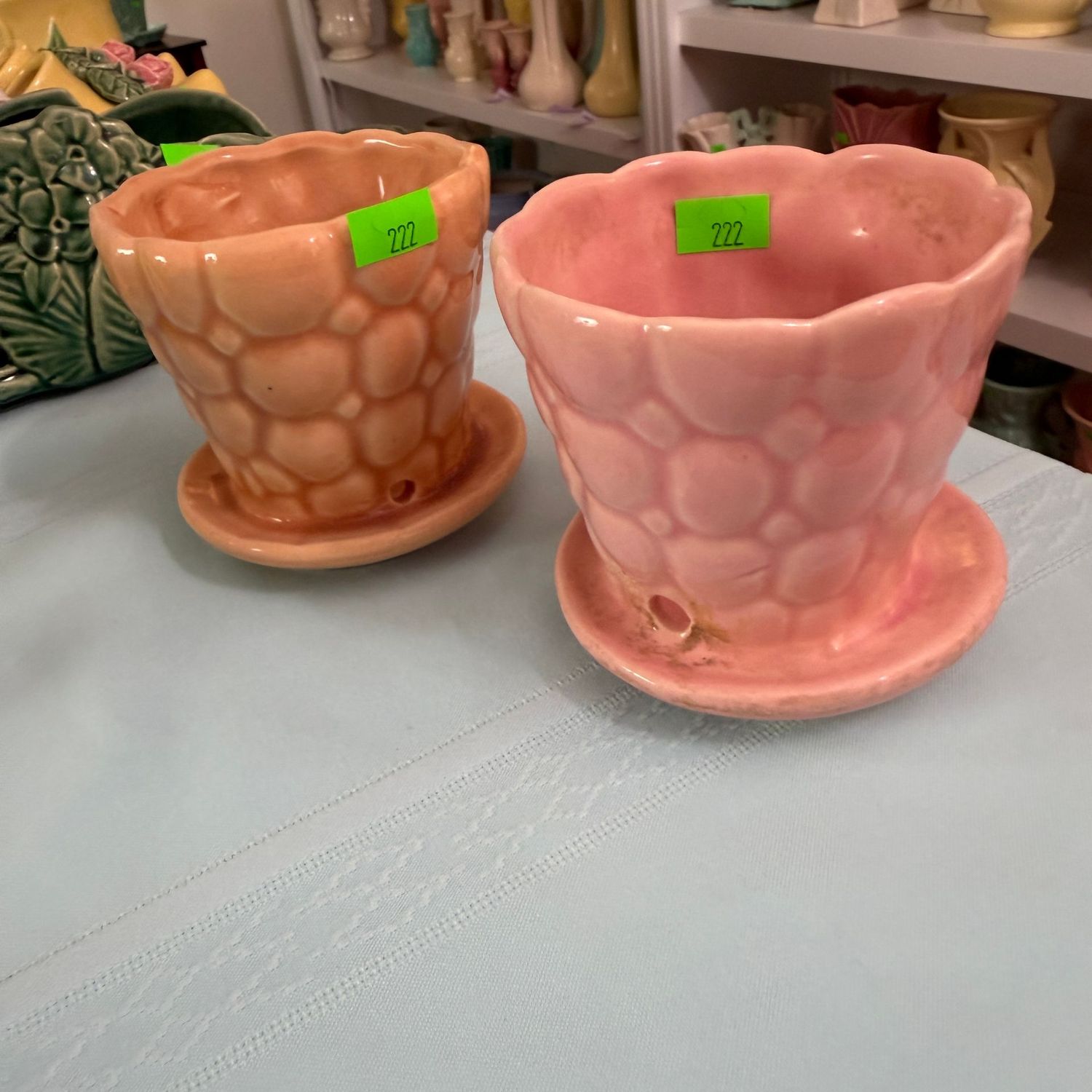 Lot #222, two McCoy pottery pebble planters, apricot, and pink, 3.5"