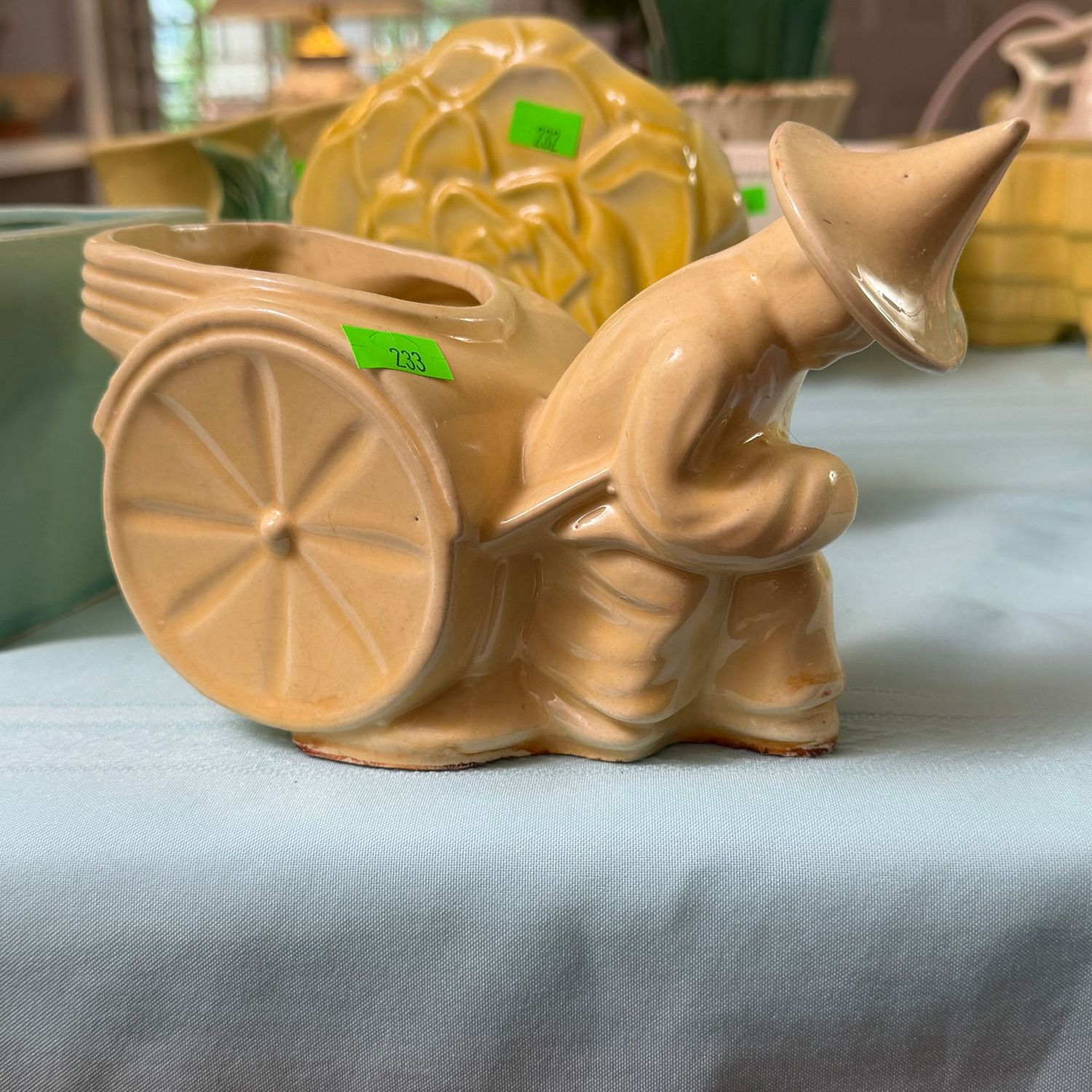 Lot #233, yellow pottery rickshaw planter, 4.5 Lot #233, yellow pottery rickshaw planter, 4.5"H