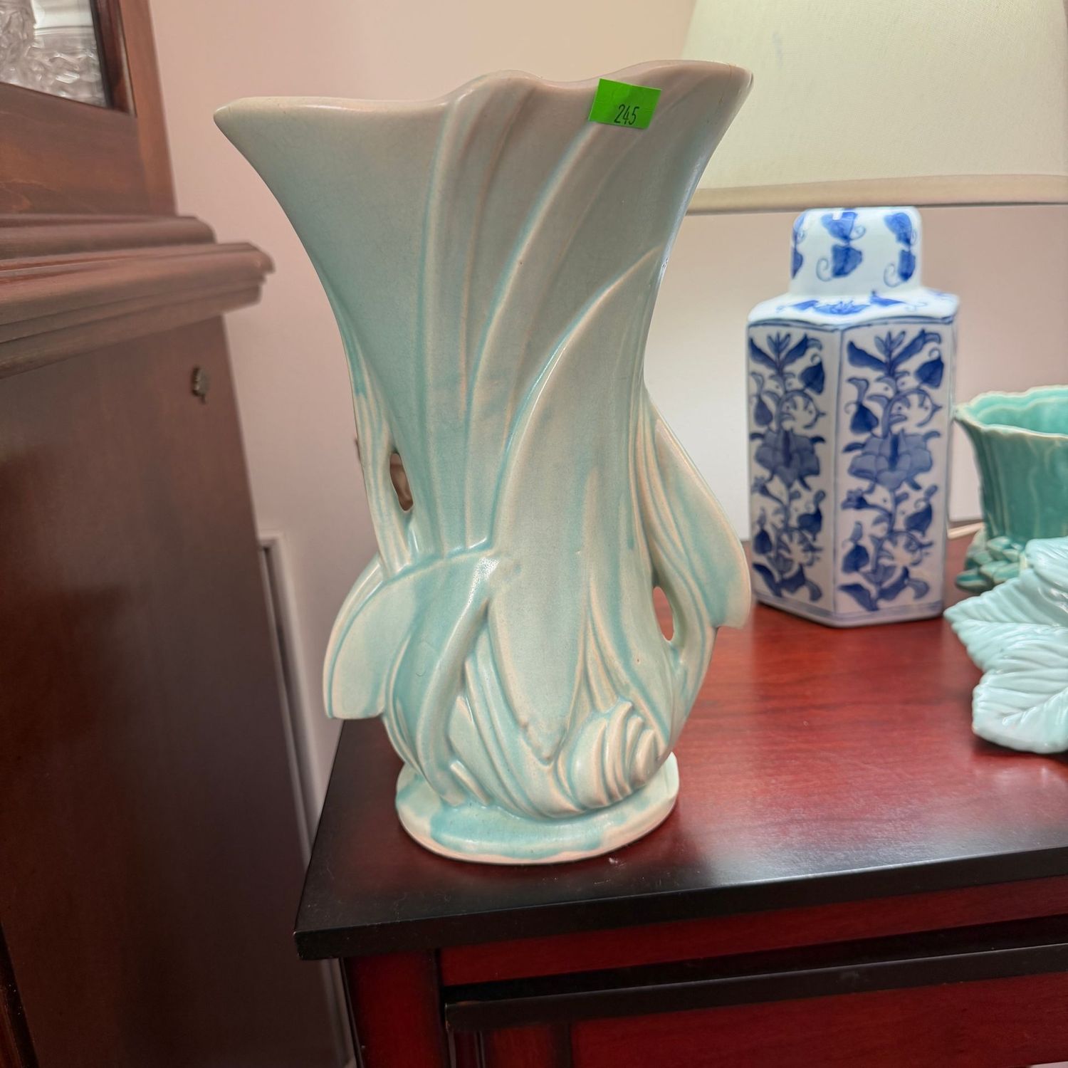 Lot #245, light green McCoy Pottery arrow leaf vase, some chips on lip, a few hairline cracks, 10 Lot #245, light green McCoy Pottery arrow leaf vase, some chips on lip, a few hairline cracks, 10"