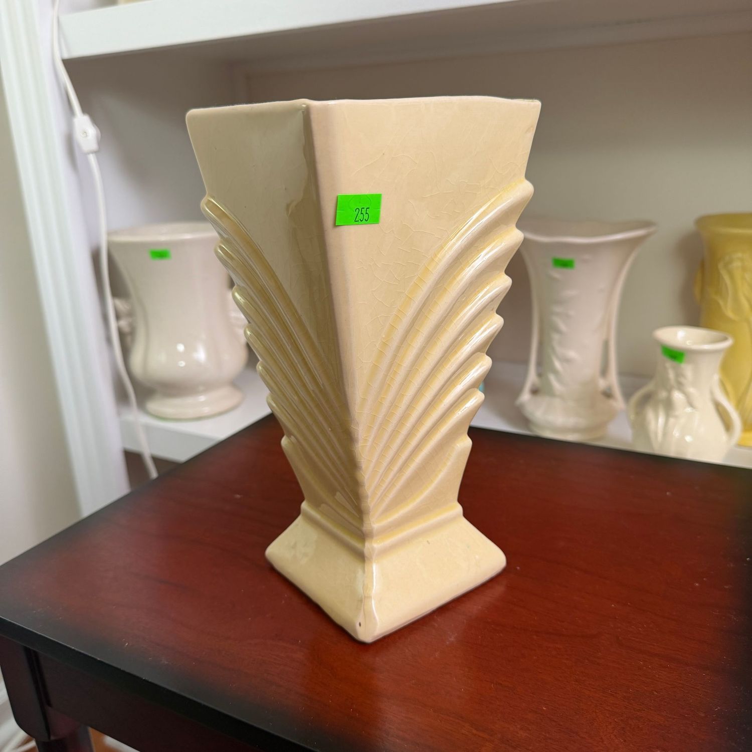 Lot #255, pale yellow, early McCoy pottery deco vase, repaired, 8"