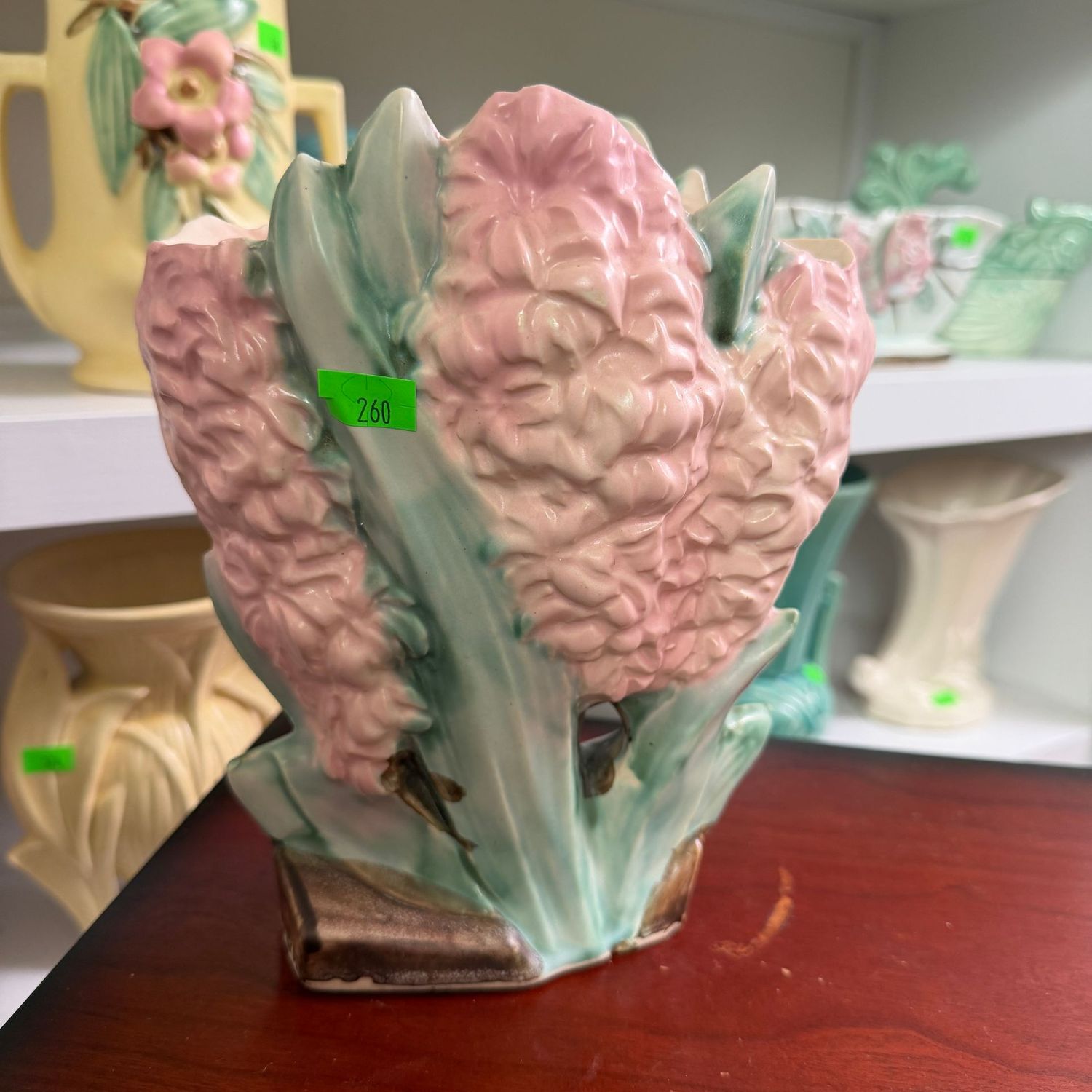Lot #260, pink hyacinth McCoy pottery vase, minor chip inside rim, 7"