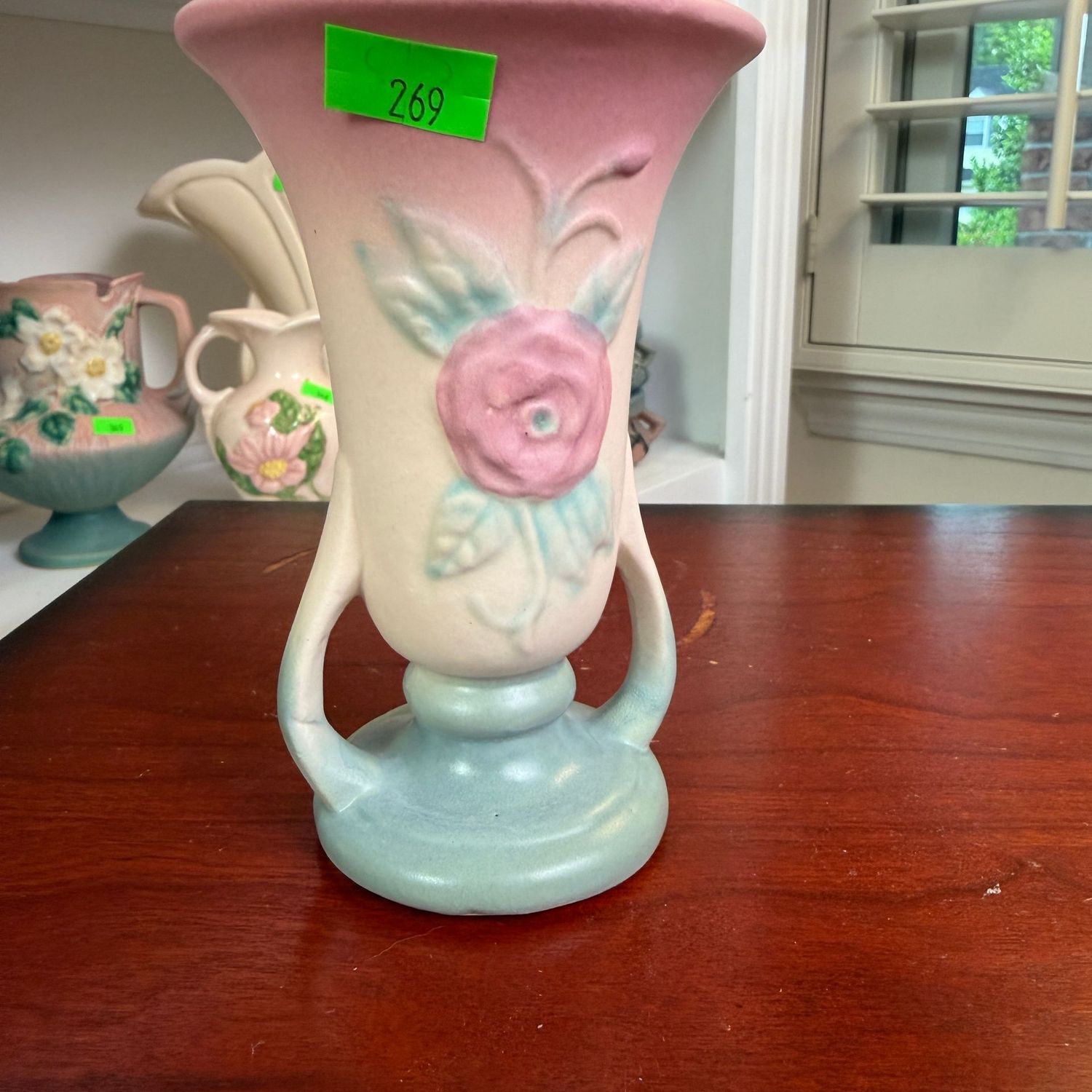Lot #269, Hull pottery Camelia, open rose slender vase, 4 1/4"