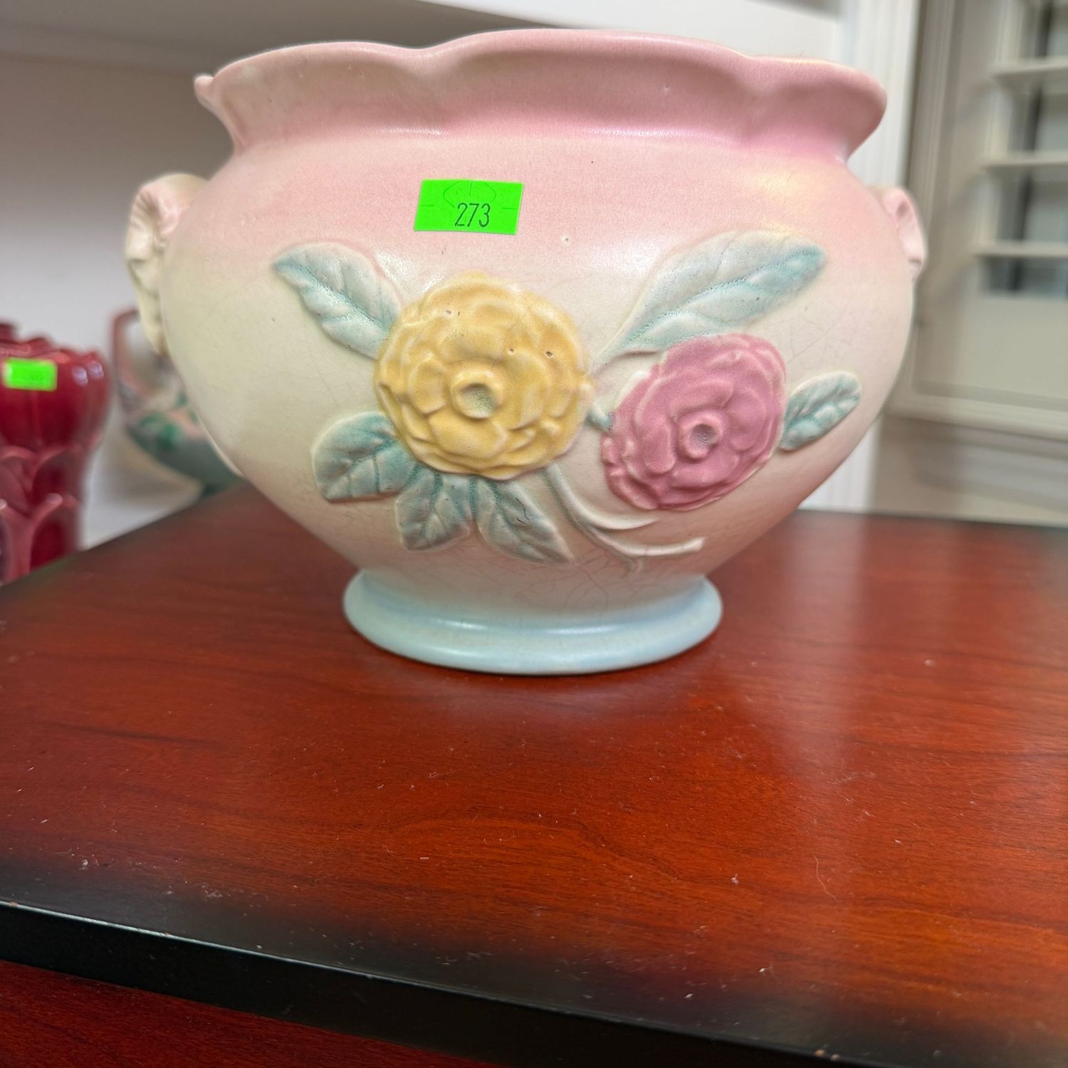 Lot #273, Hull pottery open rose round vase with ram's head handles, 6.5"W